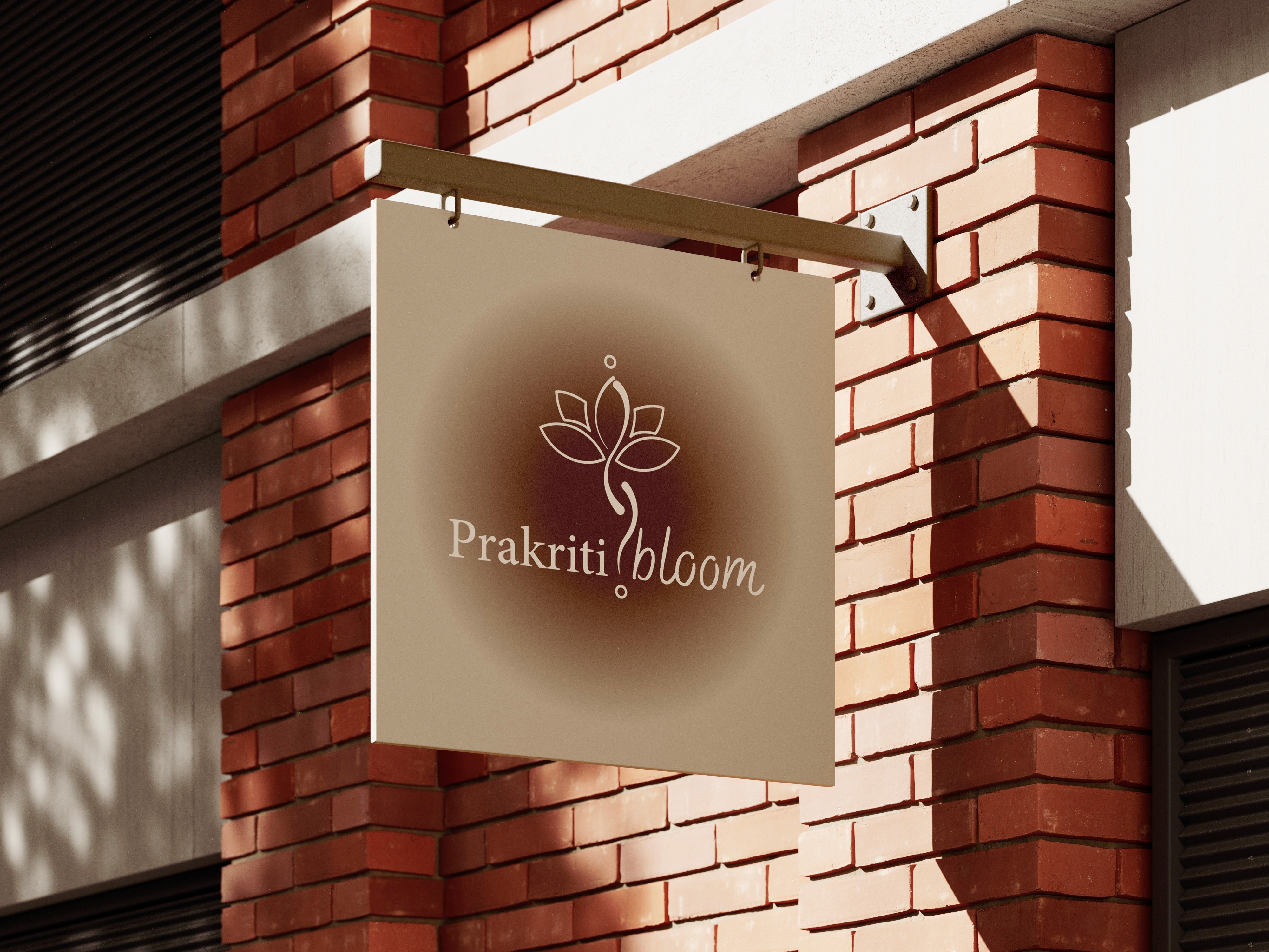 alt="Prakritibloom branding sign mockup on a brick building"