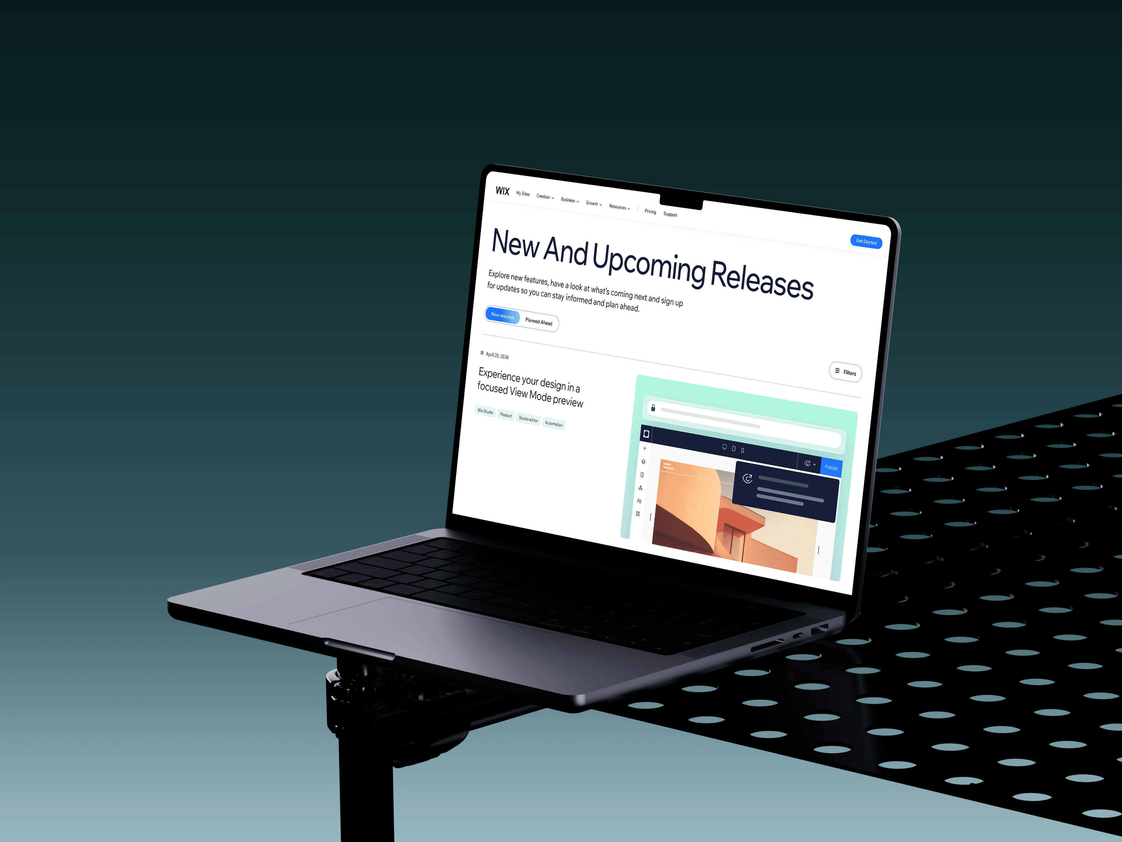 Laptop on a stand displaying a releases and roadmap web design project