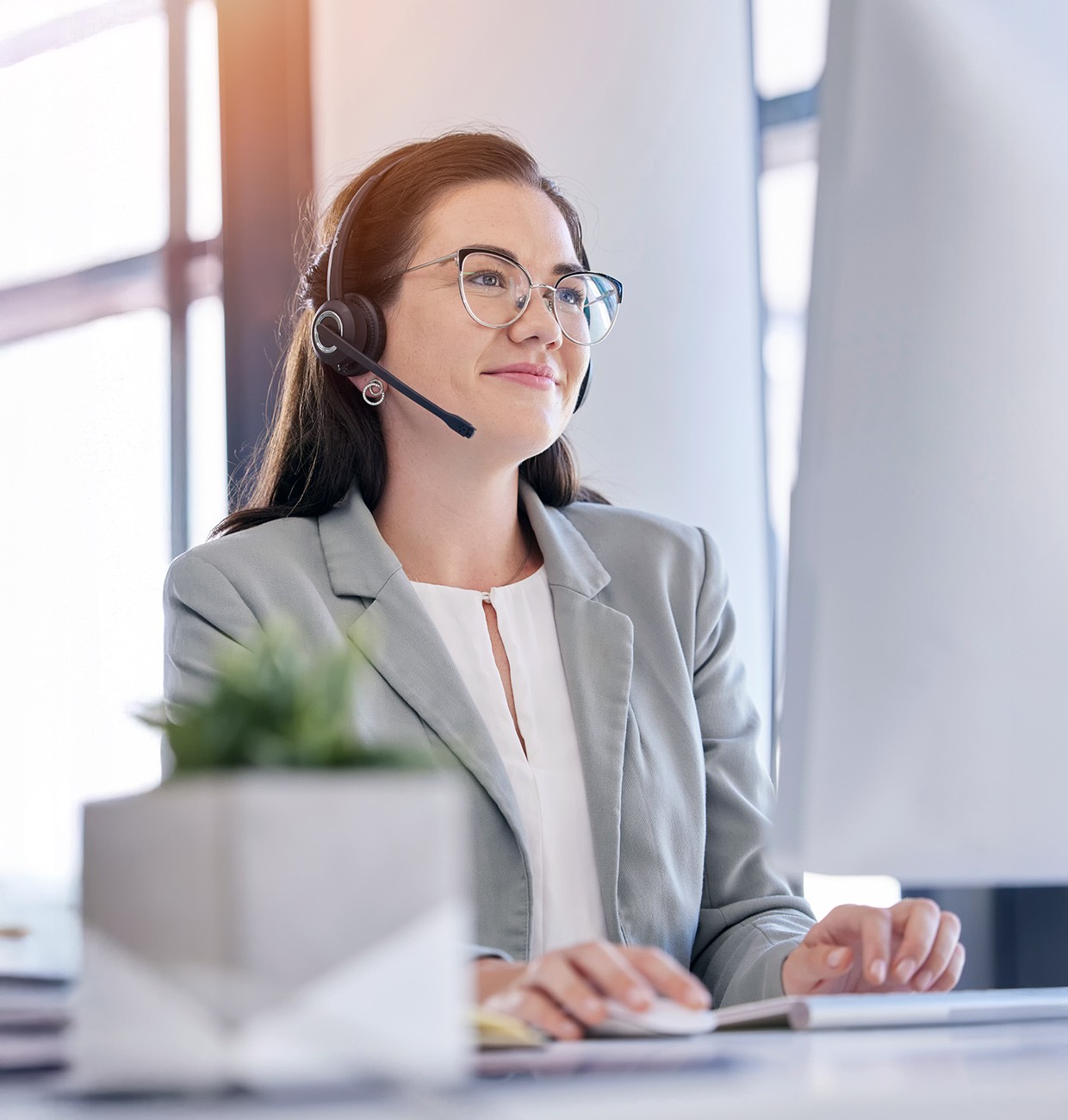 Woman telemarketing typing computer call center