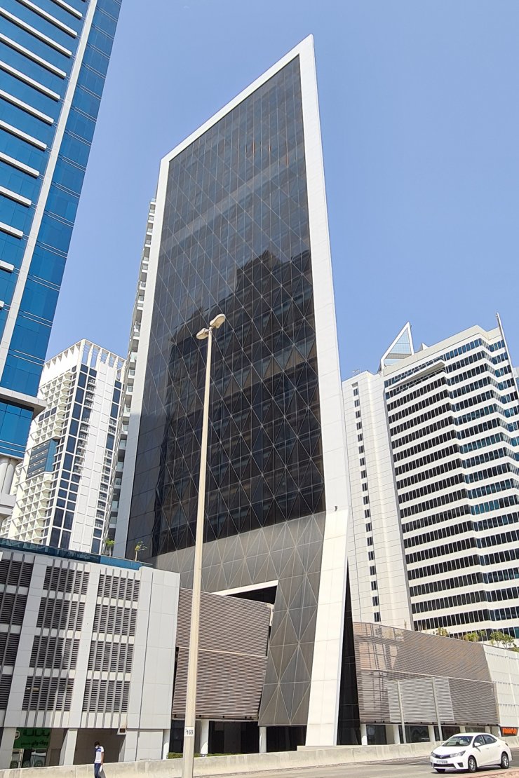 Sleek architectural side view of the building. Contact our professional agents for exclusive listings in this tower.