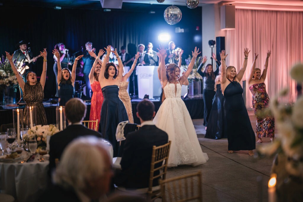 Seattle wedding dance floor tips at work as the bride pulls guests of every age onto a full dance floor
