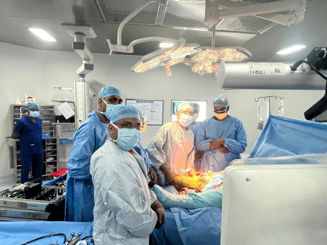 A large gold futuristic tank on a rooftop overlooking a skyscraper city