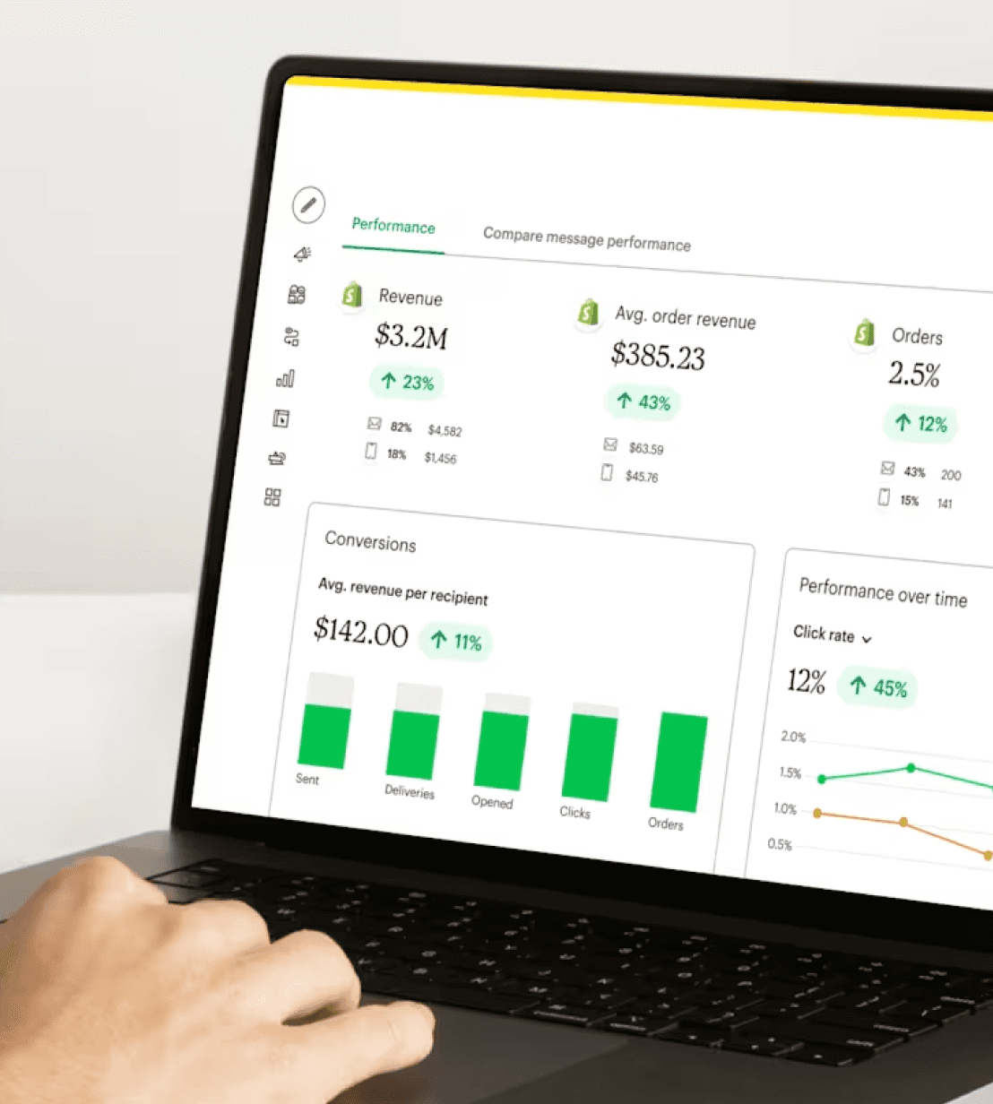 A person focused on a laptop displaying a data dashboard, analyzing information for decision-making.