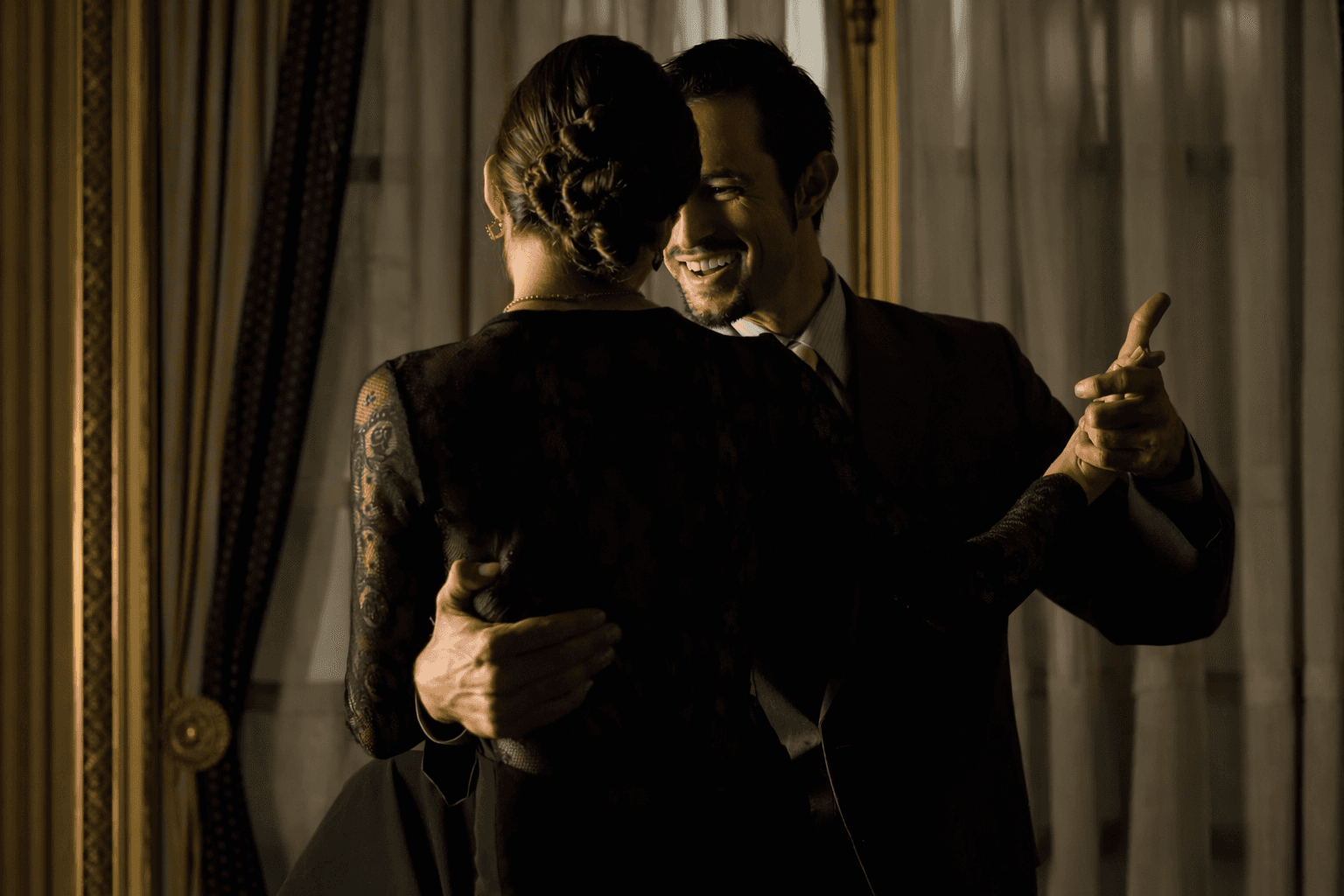 Couple dancing tango at a traditional Buenos Aires milonga