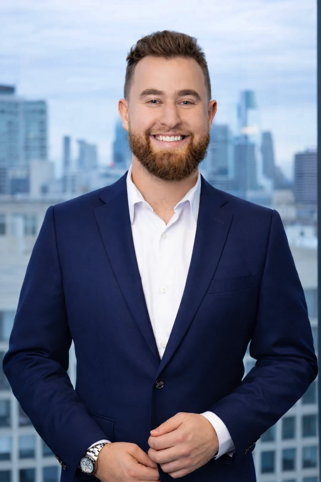 Max Karasick, Compass real estate agent, with the Philadelphia skyline behind him
