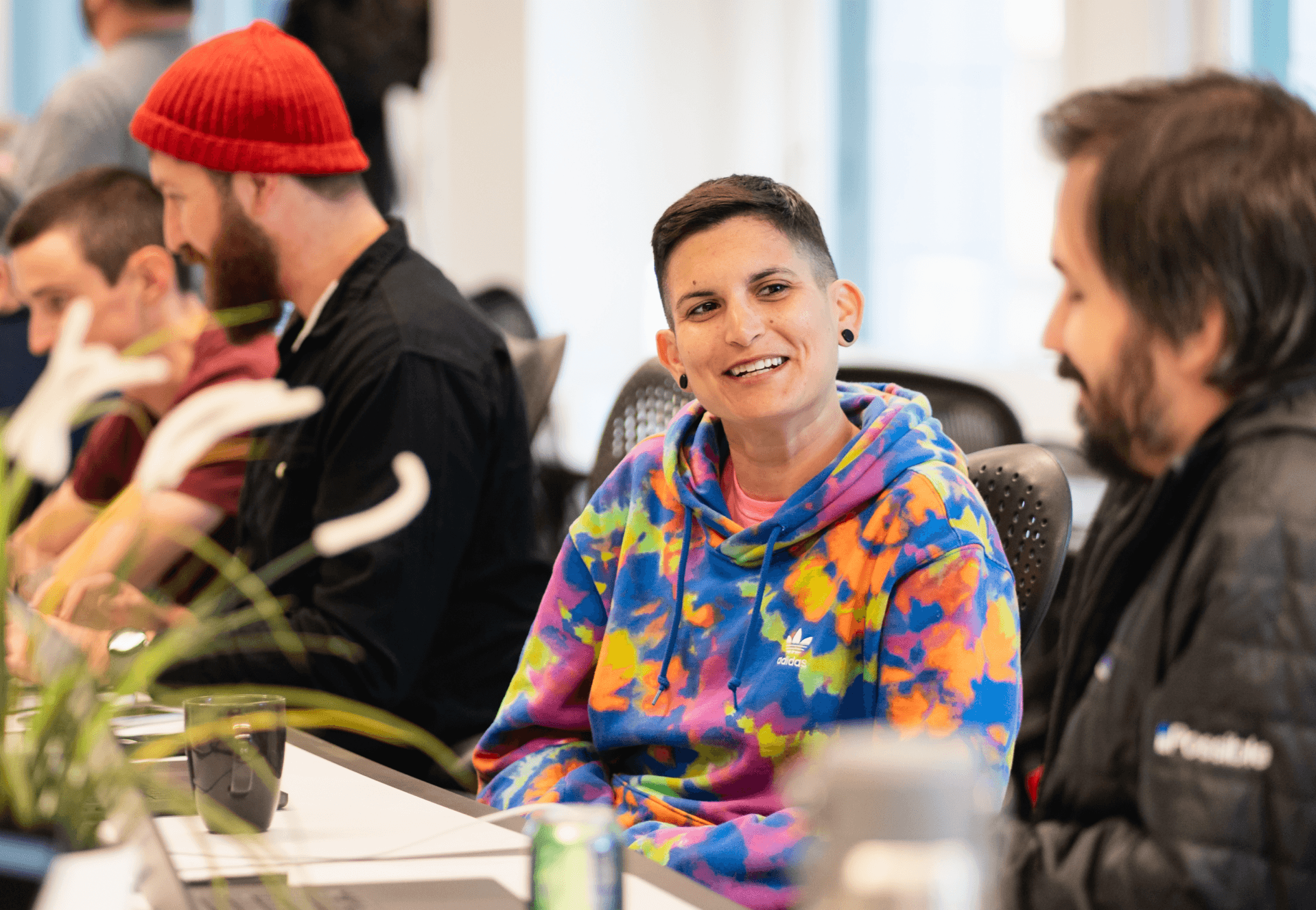 Possible employees at a conference table.