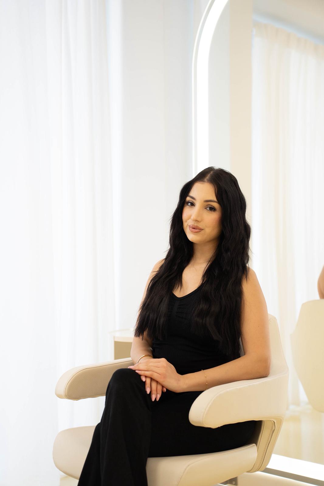 person sitting in a chair in front of a man