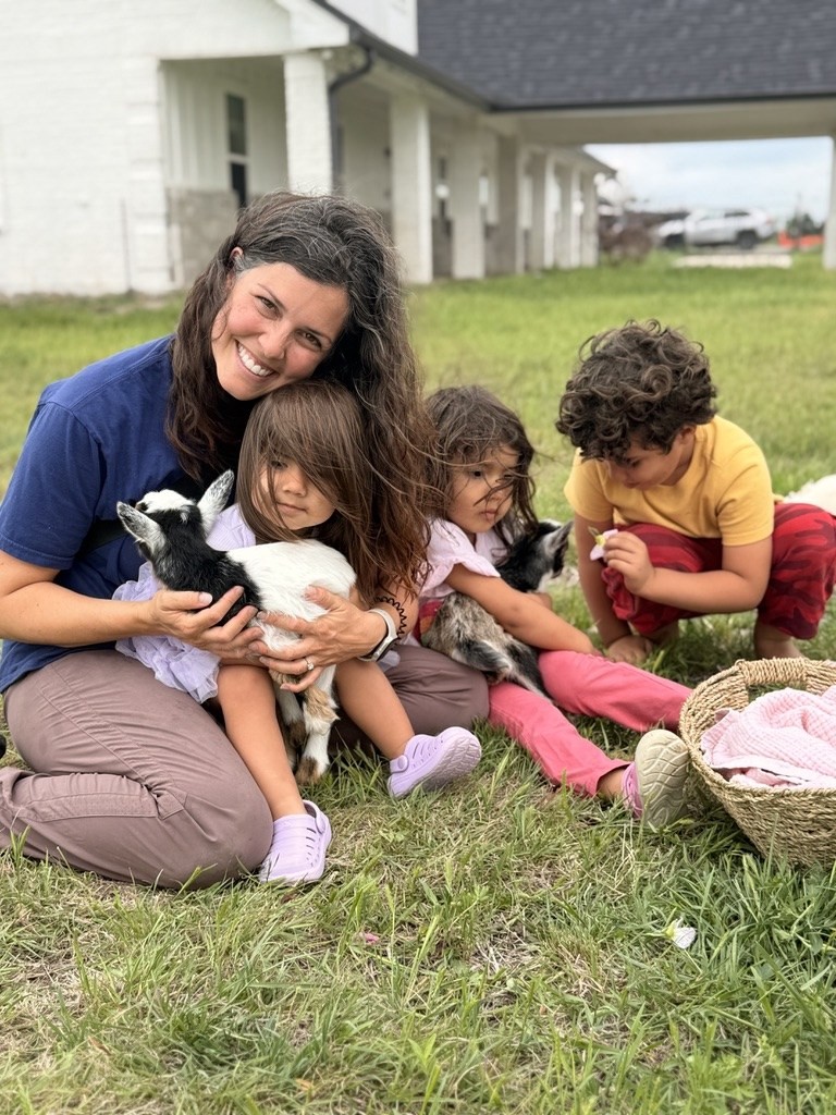 Brittney with a goat on family property near Forney, Texas