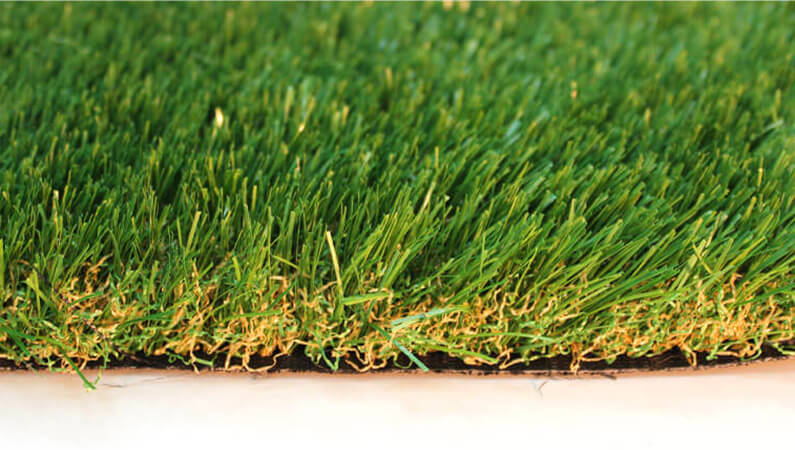 AGL Grass North's non-toxic, Pet-Friendly K9 artificial turf is super soft with green and yellow strands.