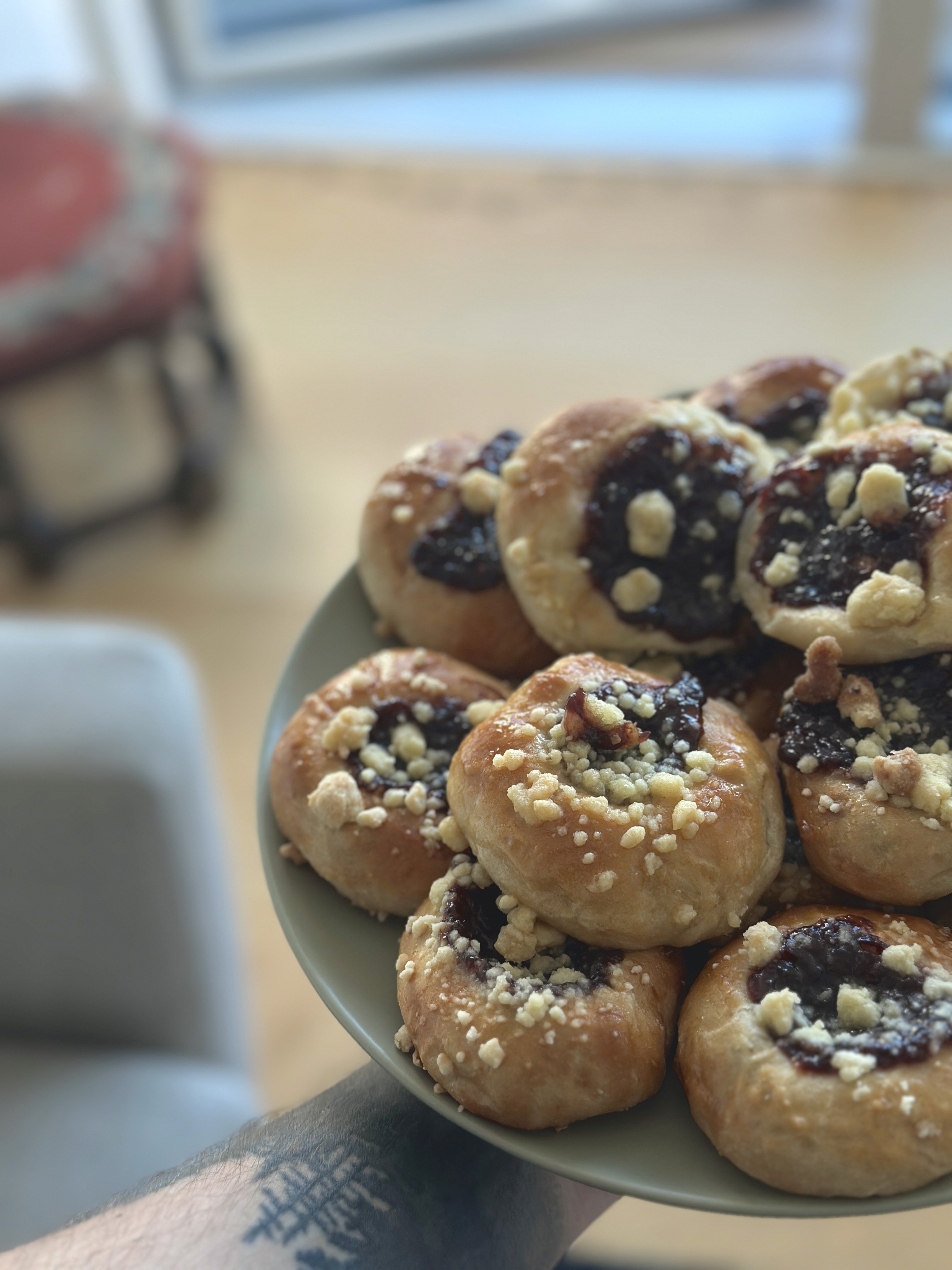 a group of people walking on a sidewalk