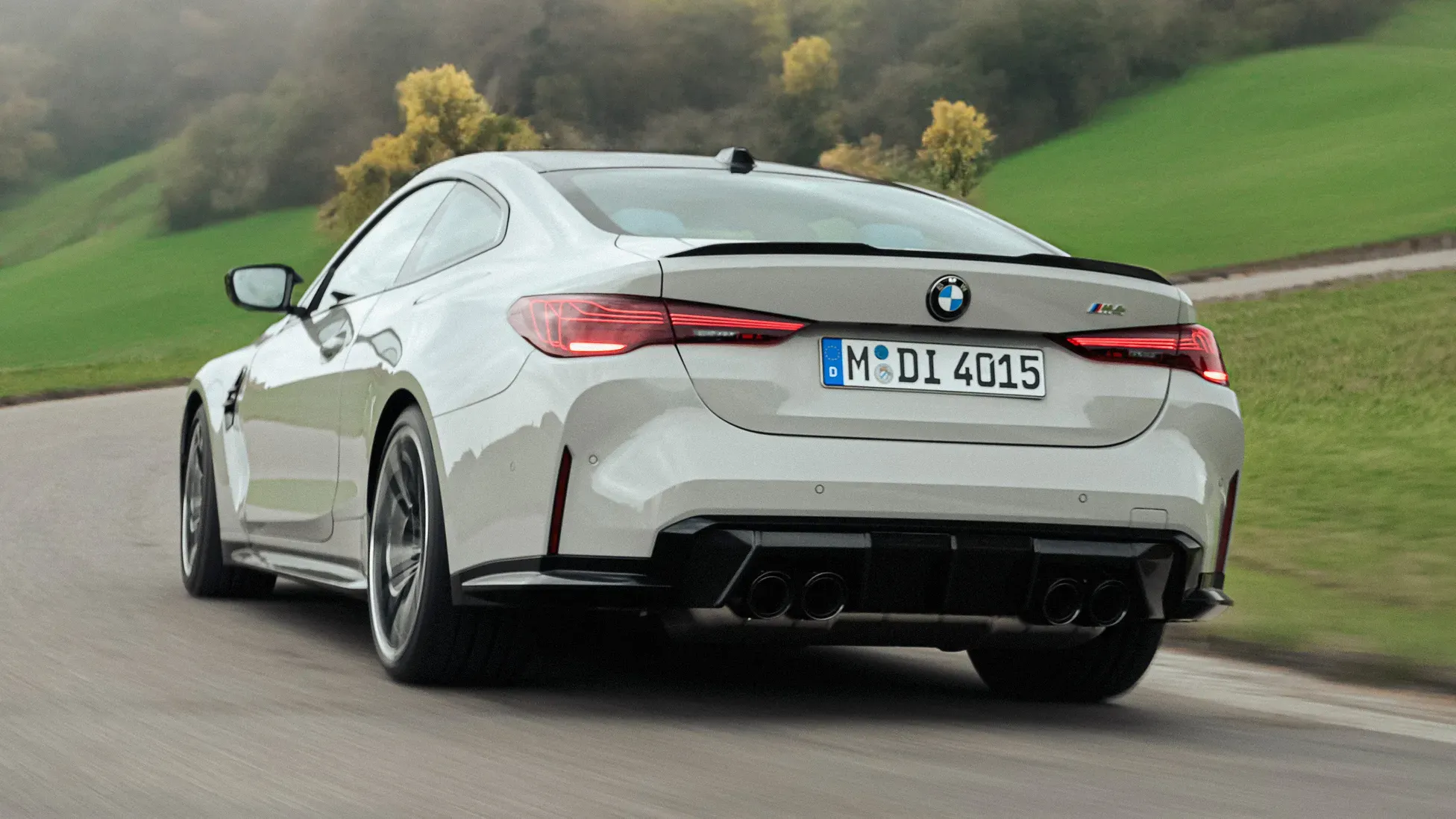 Rear view, white performance coupe