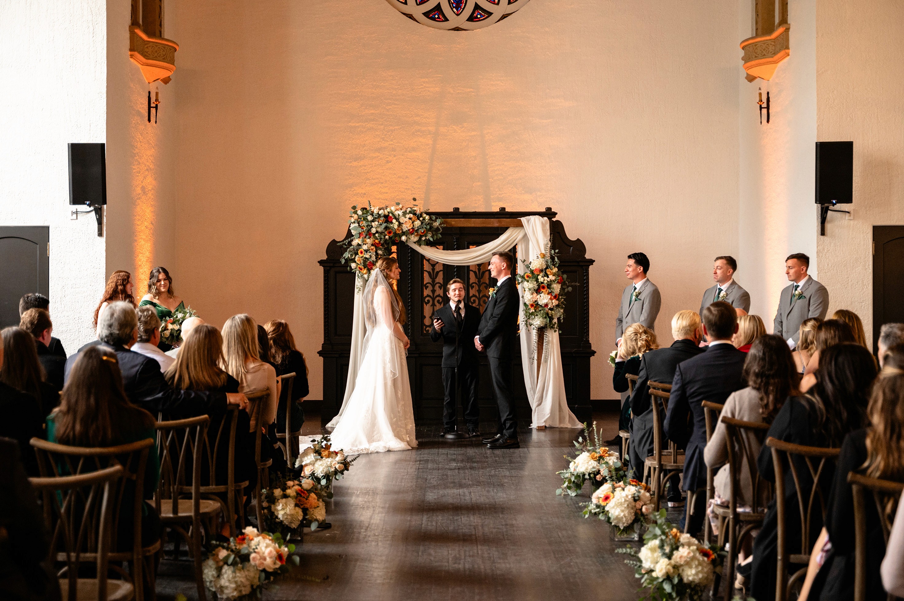 Flat lay wedding details with bouquet, rings, and sparkling bridal heels