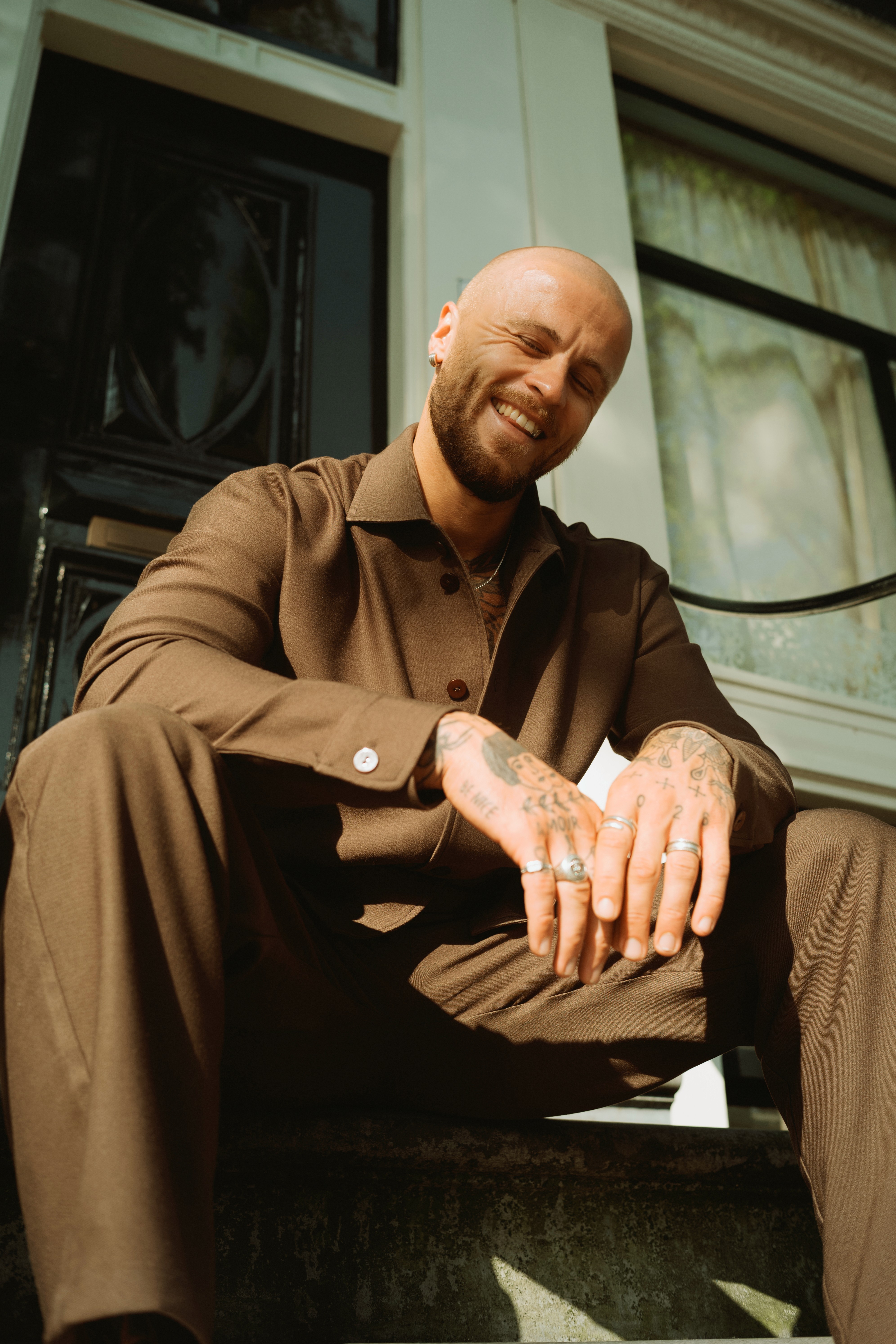 Streetside billboard with flyposters of the Batch.Works brand and illustrations