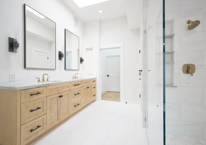 Wide view in the primary bathroom showing the large double vanity and spacious walk-in shower, epitomizing luxury and modern design in the Dana Point Full Remodel. Photo by Todd Huge.