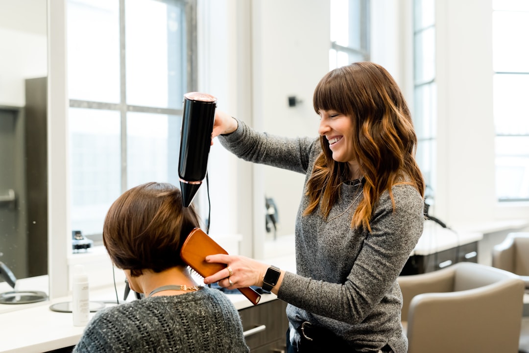 a hair salon with chairs and mirrors