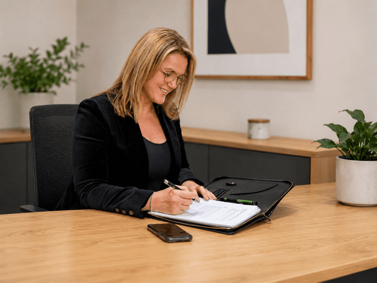 Janine Paynter working at her desk on Launchpad Strategy planning