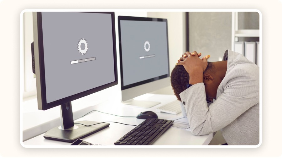 two computer screens stuck loading