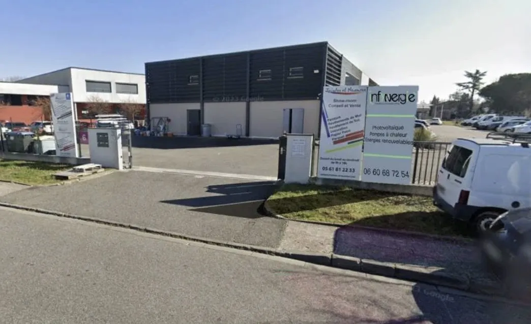 a woman sitting on a couch using a laptop
