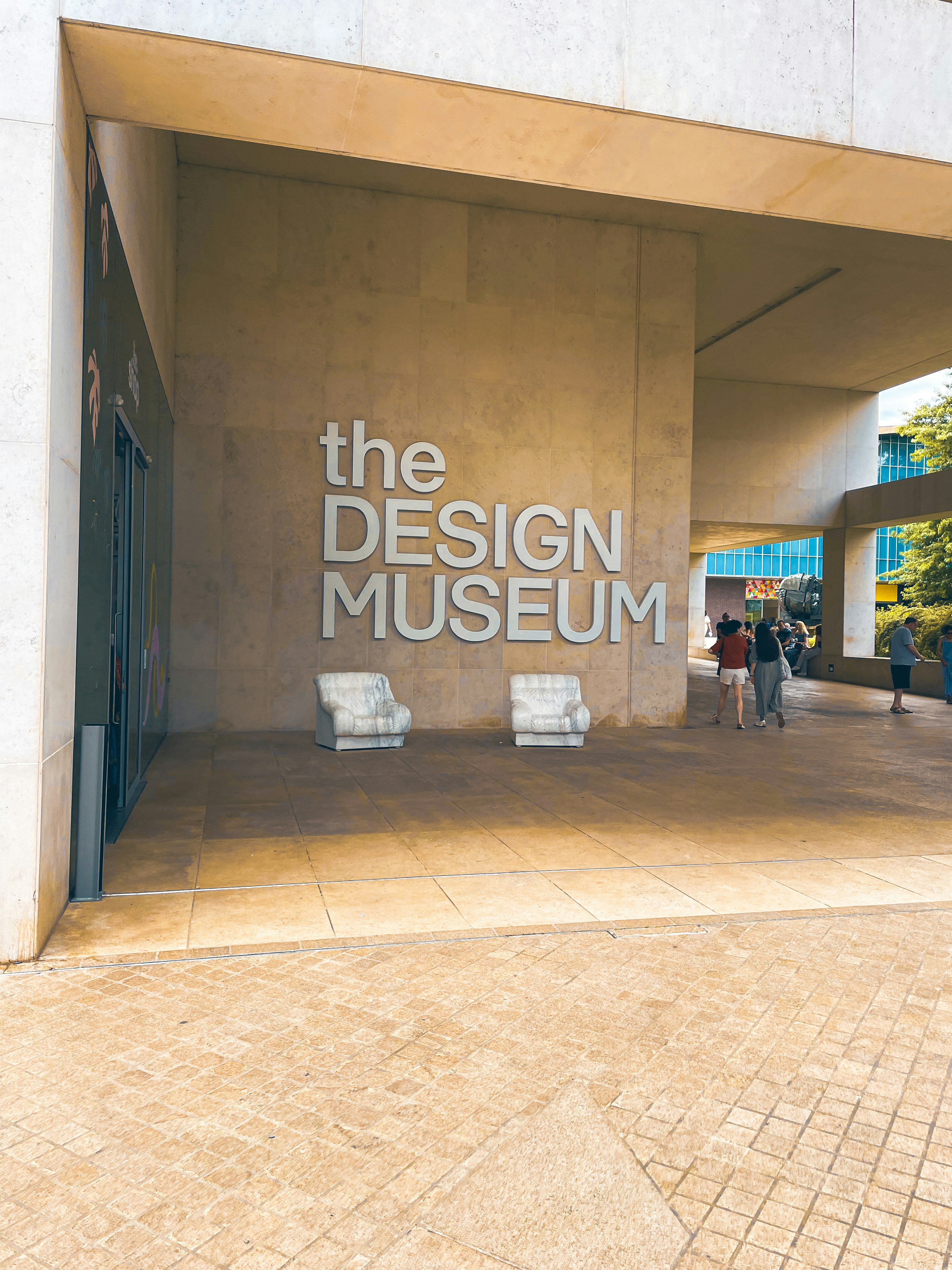 The entrance to the design museum with people walking by