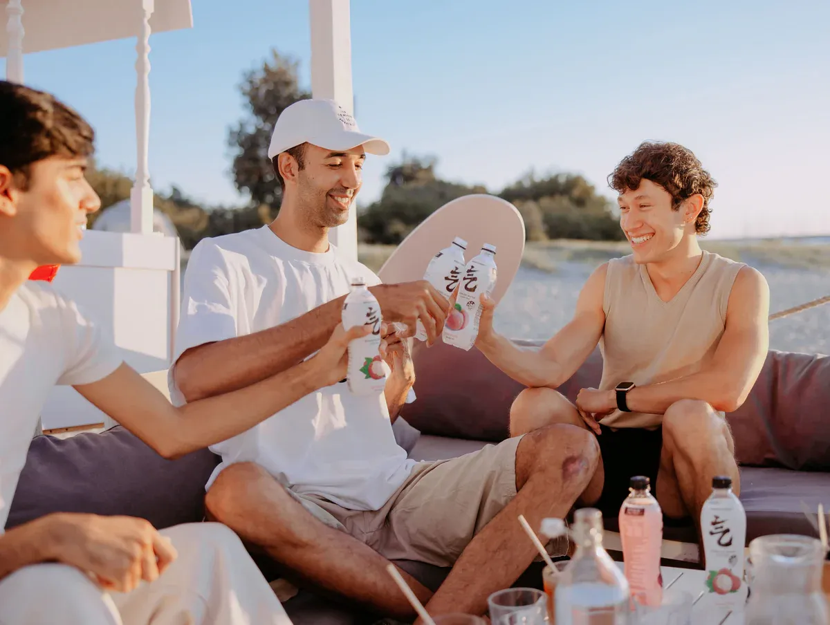 Friends enjoying Chi Forest drinks outdoors in Australia