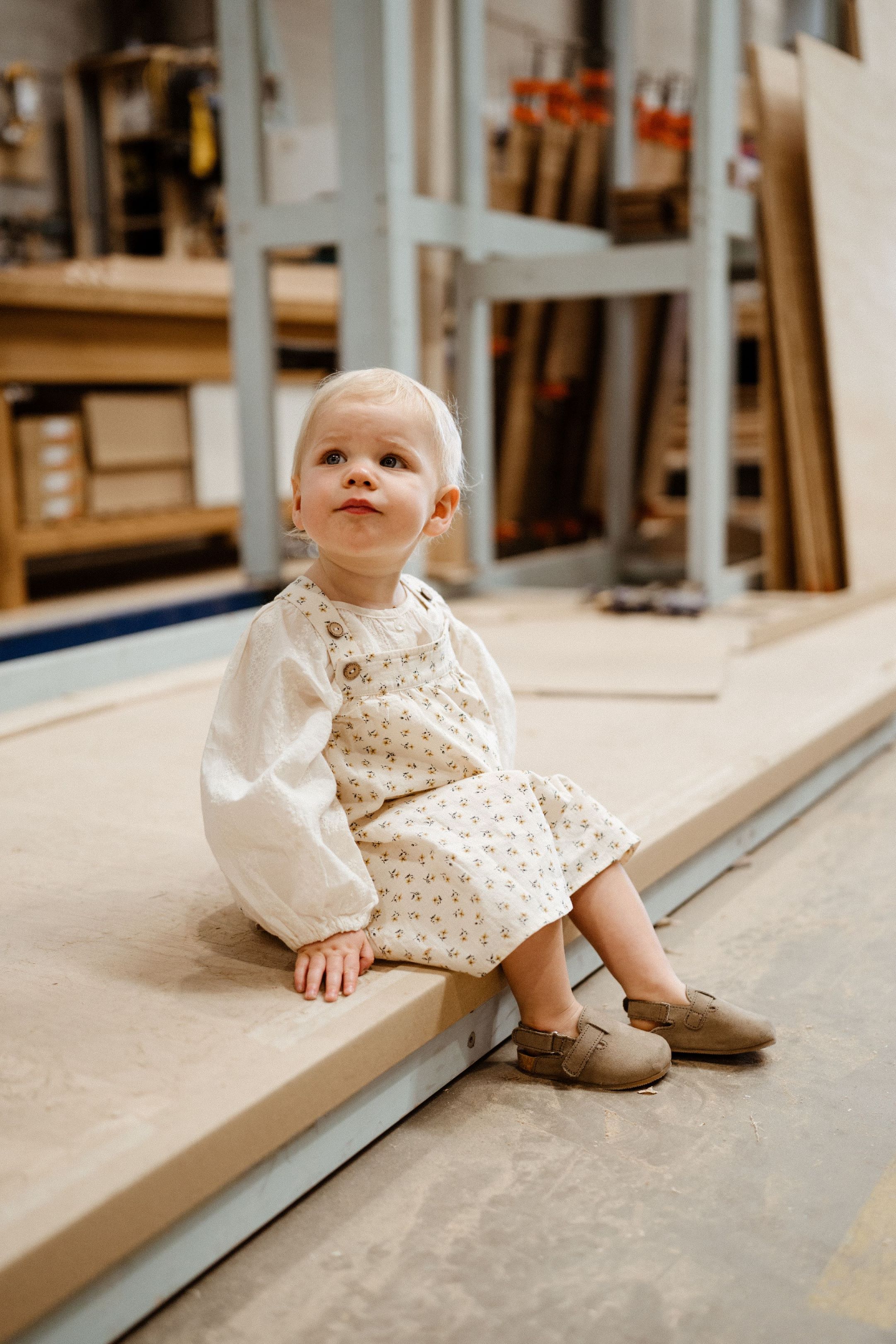 A fast black sports car races down the highway.