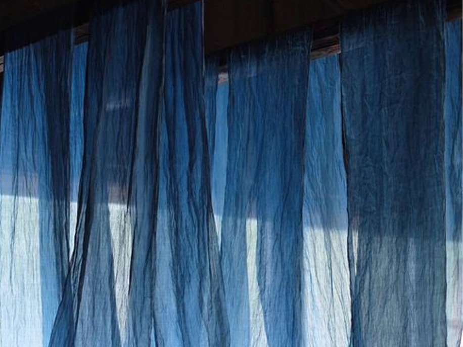 Blue indigo textile curtains with soft daylight – design inspiration for Indigo Atelier luxury villas in Bali