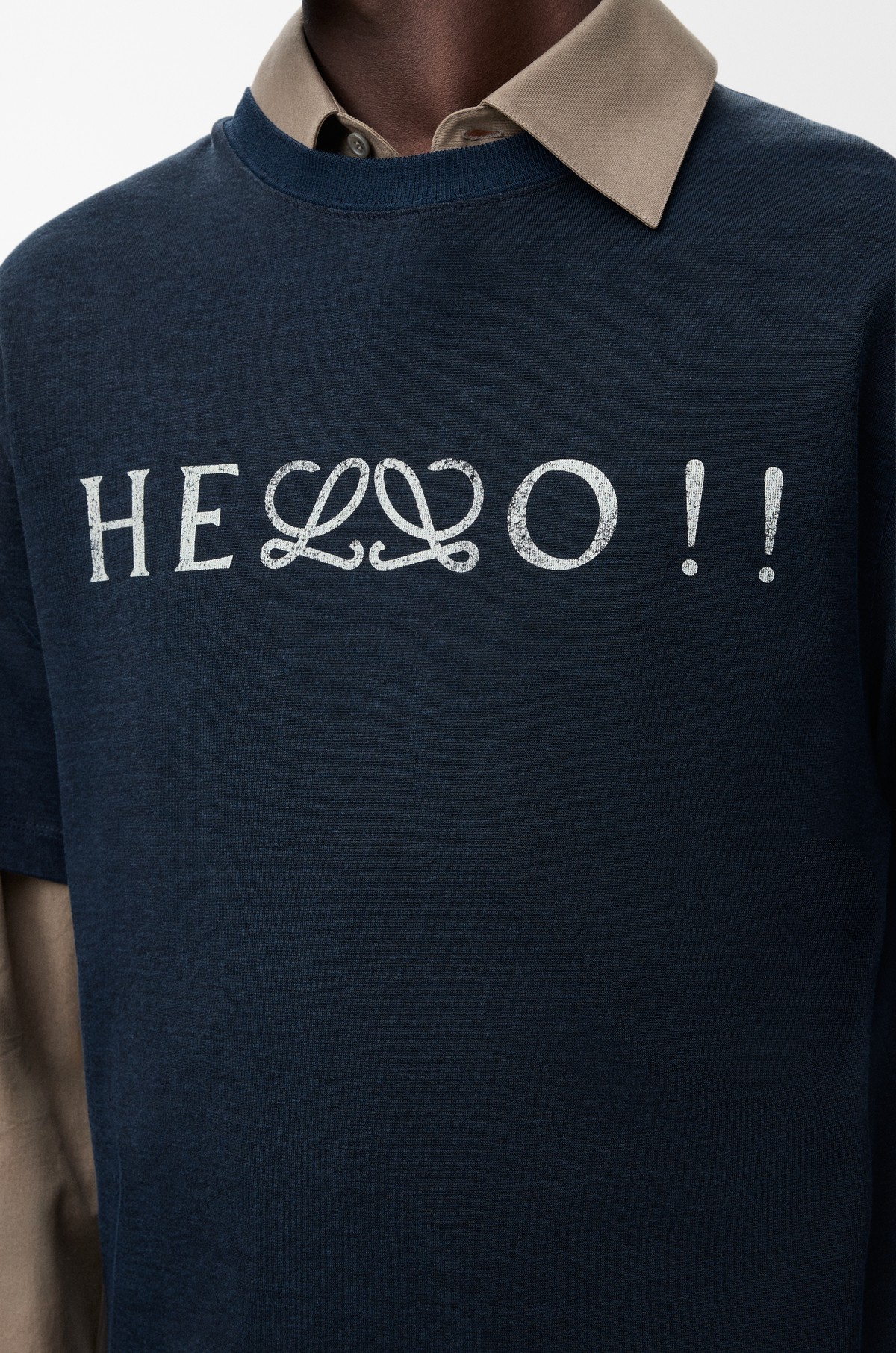 Loewe new logo integrated into apparel design, demonstrating the refined anagram used as a graphic element