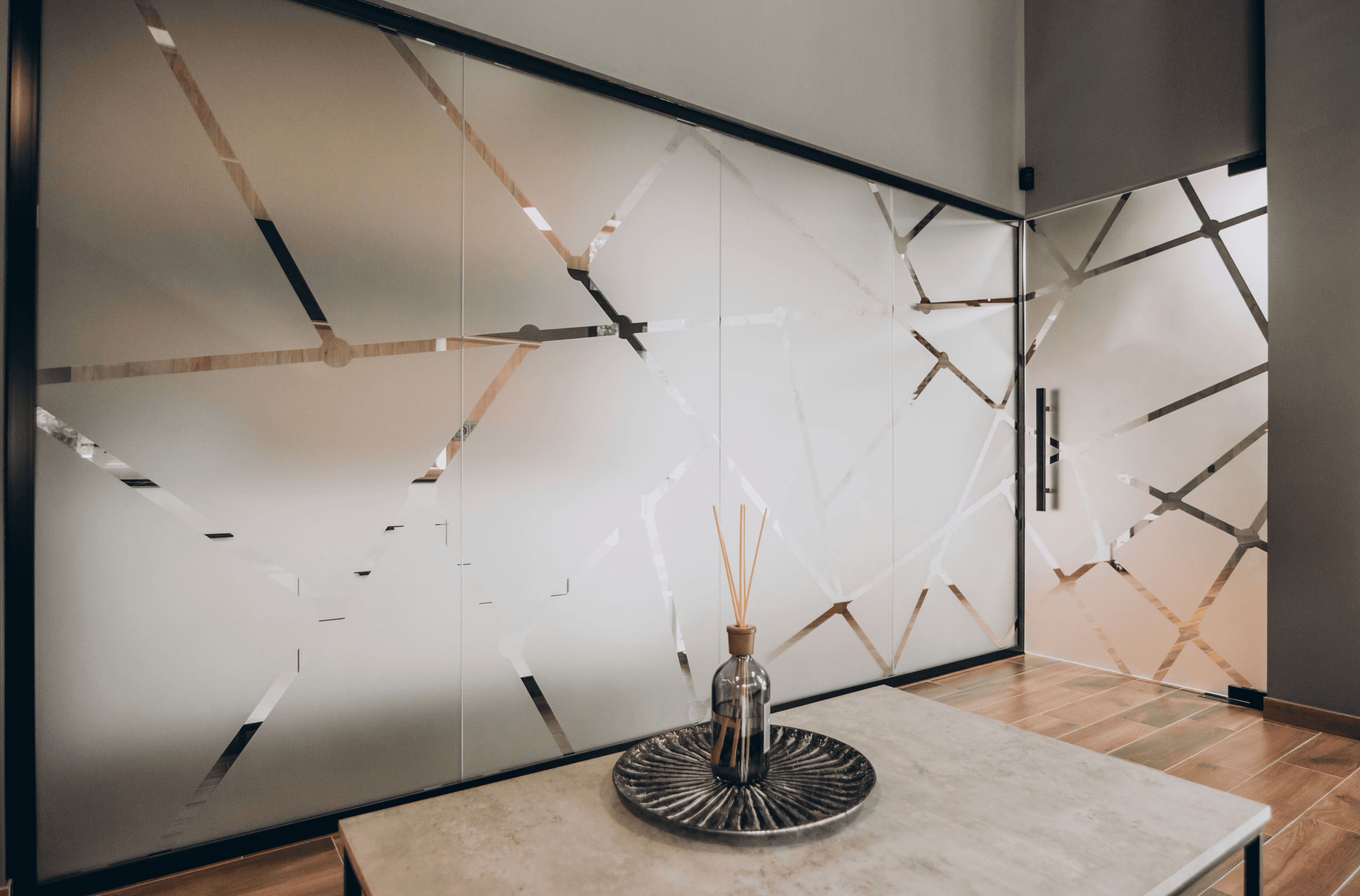A glass filled with liquid sitting on top of a table