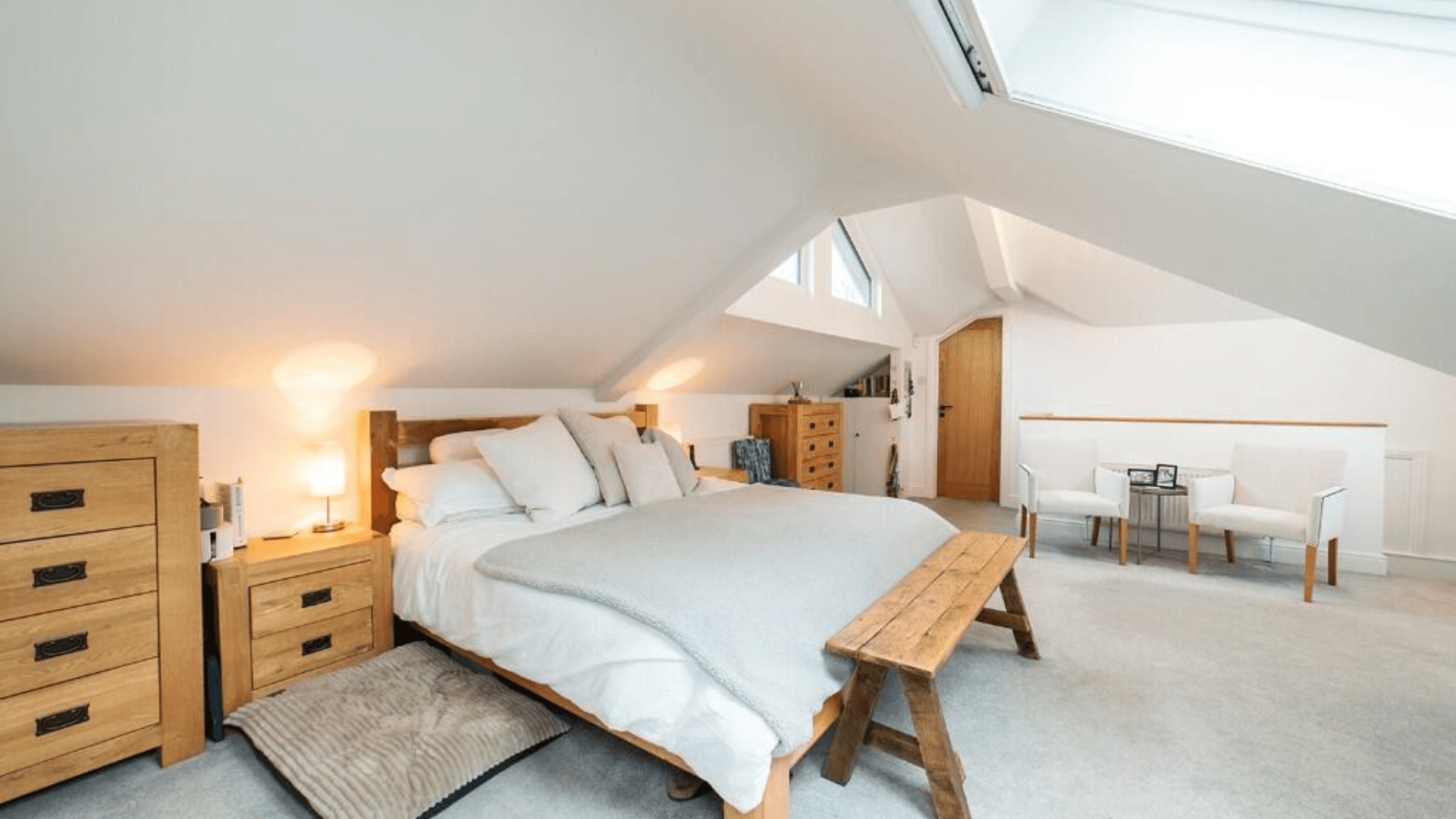 two men working on the roof of a house