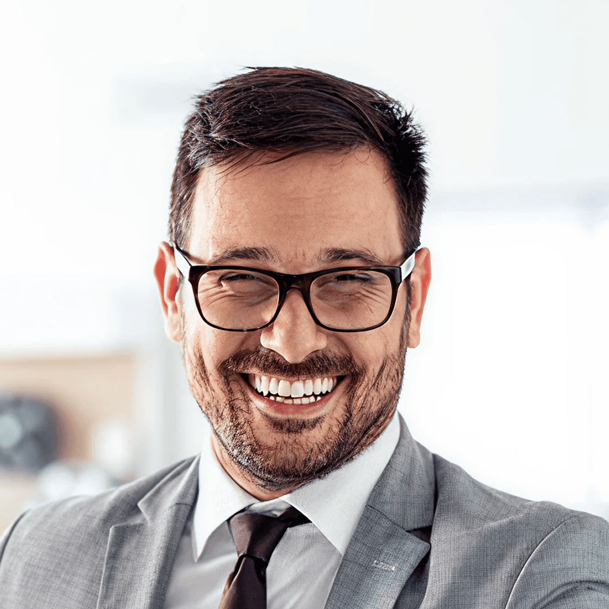 Smiling businessman wearing glasses and suit