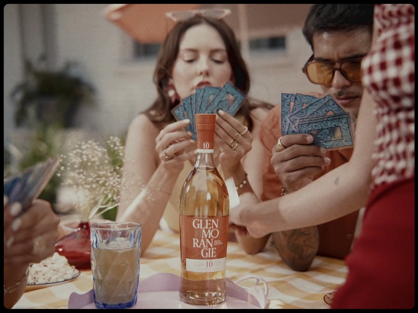 cinematic still from the Vinoteca "Summerliers" commercial, where the light reveals the essence of a shared summer experience produced by antimateria films and dir by mike bautista with talent agency