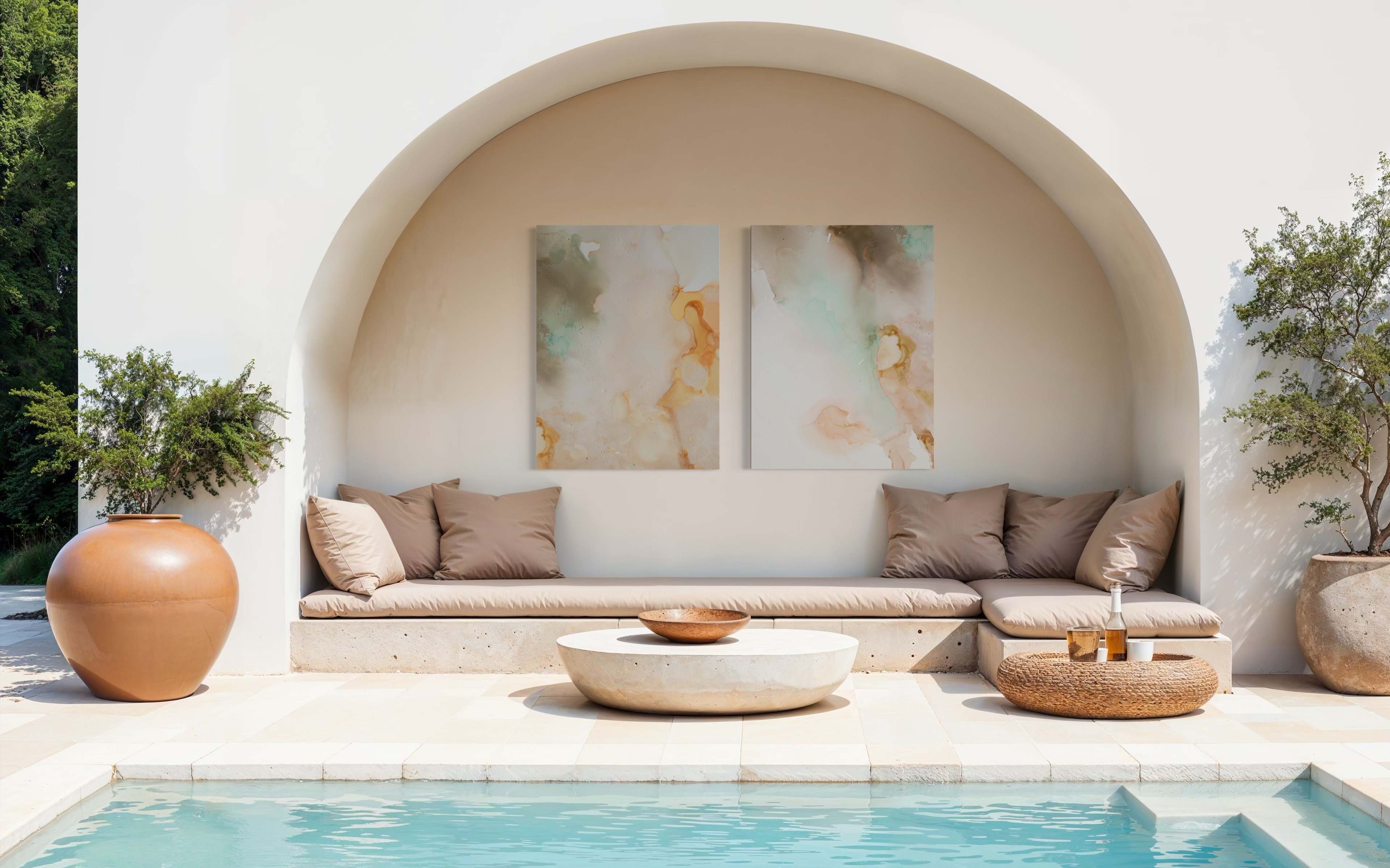 Hands pinning photographs on a white wall