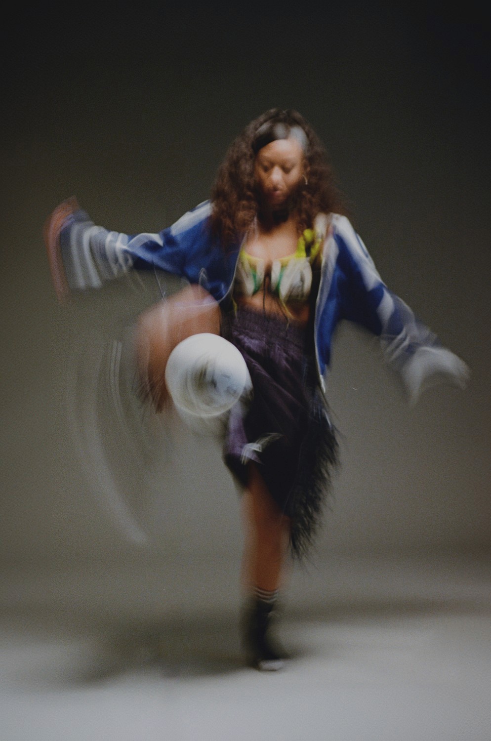 Shiba Inu dog jumping to catch falling autumn leaves