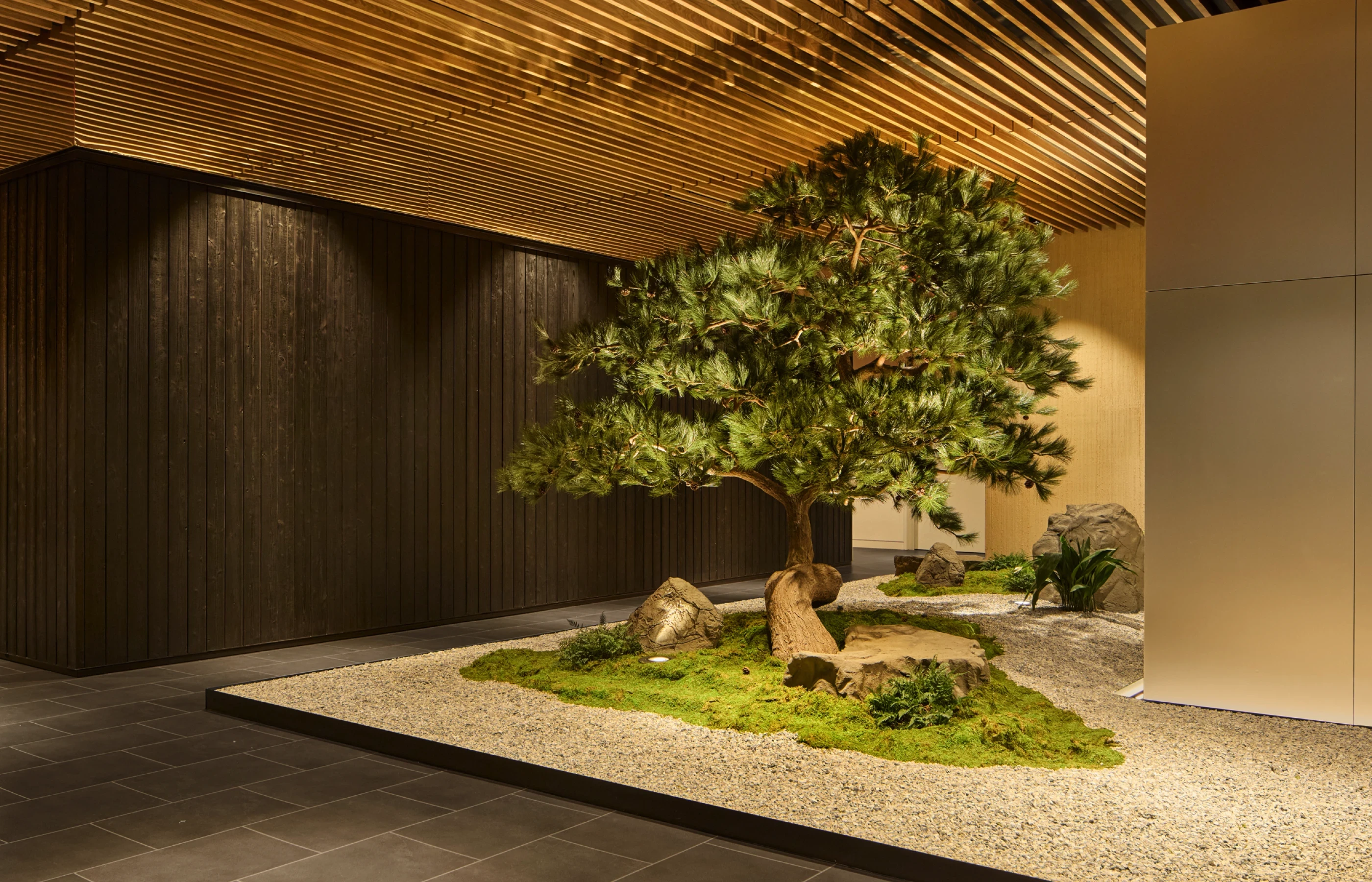 Biograph NYC hallway with natural design elements and a central tree for a serene experience.