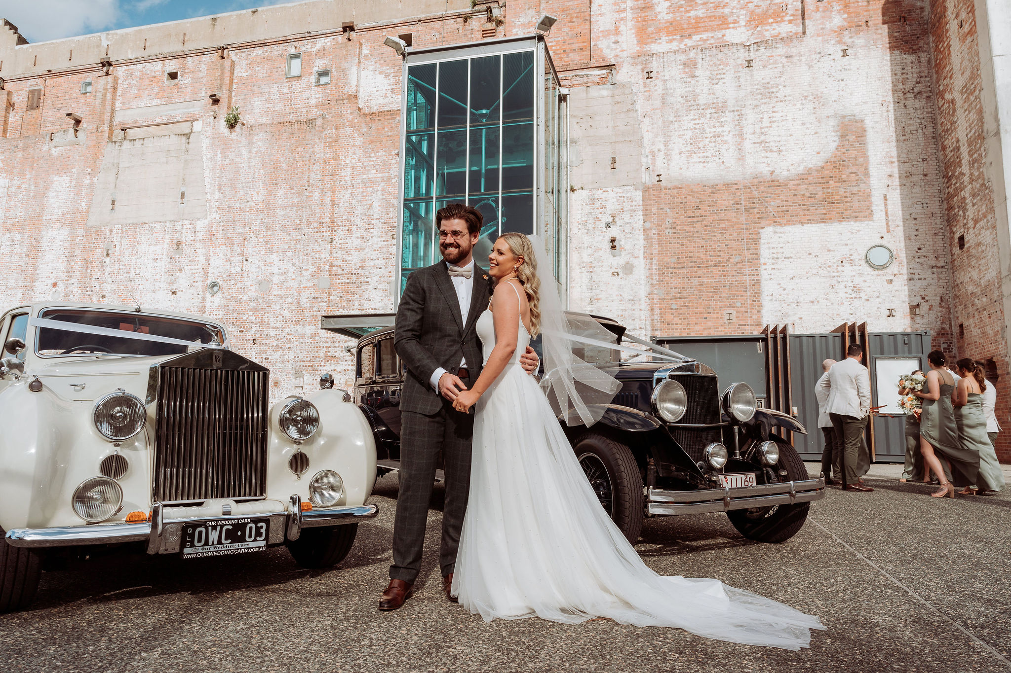 Bride & Groom photoshoot with vintage vehicles outside of the Brisbane Powerhouse