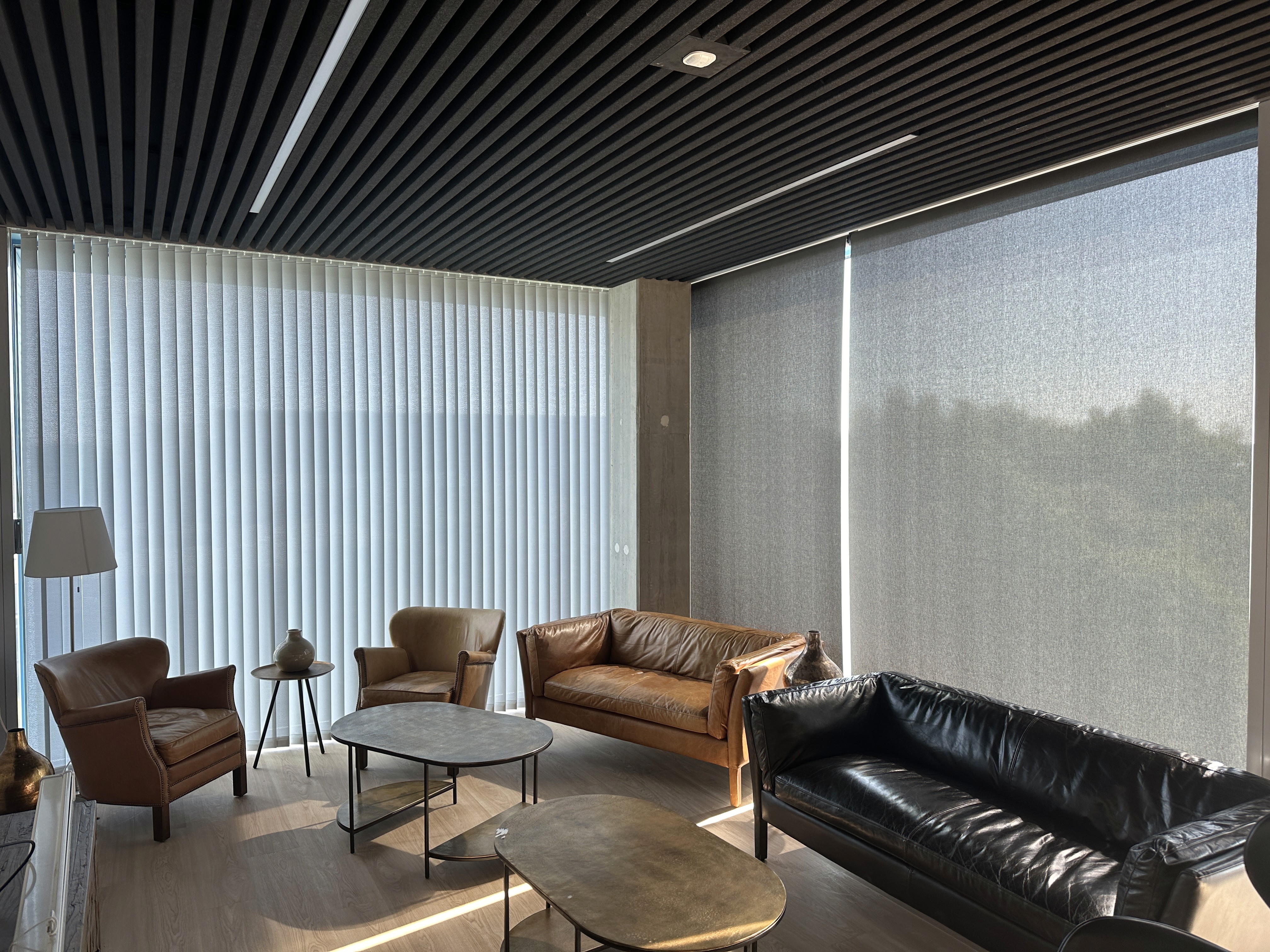 Circular skylight casting a soft glow in a restrained, contemplative interior