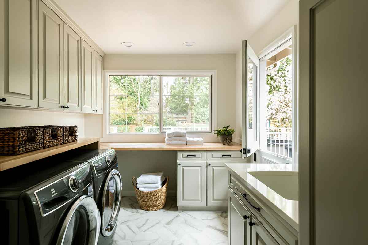 Remodeled Laundry Room in the Redmond House of Redmond, WA.  Beautiful airy and light, Elegant Simplicity takes Home Organization and Full service Interior design to the next level