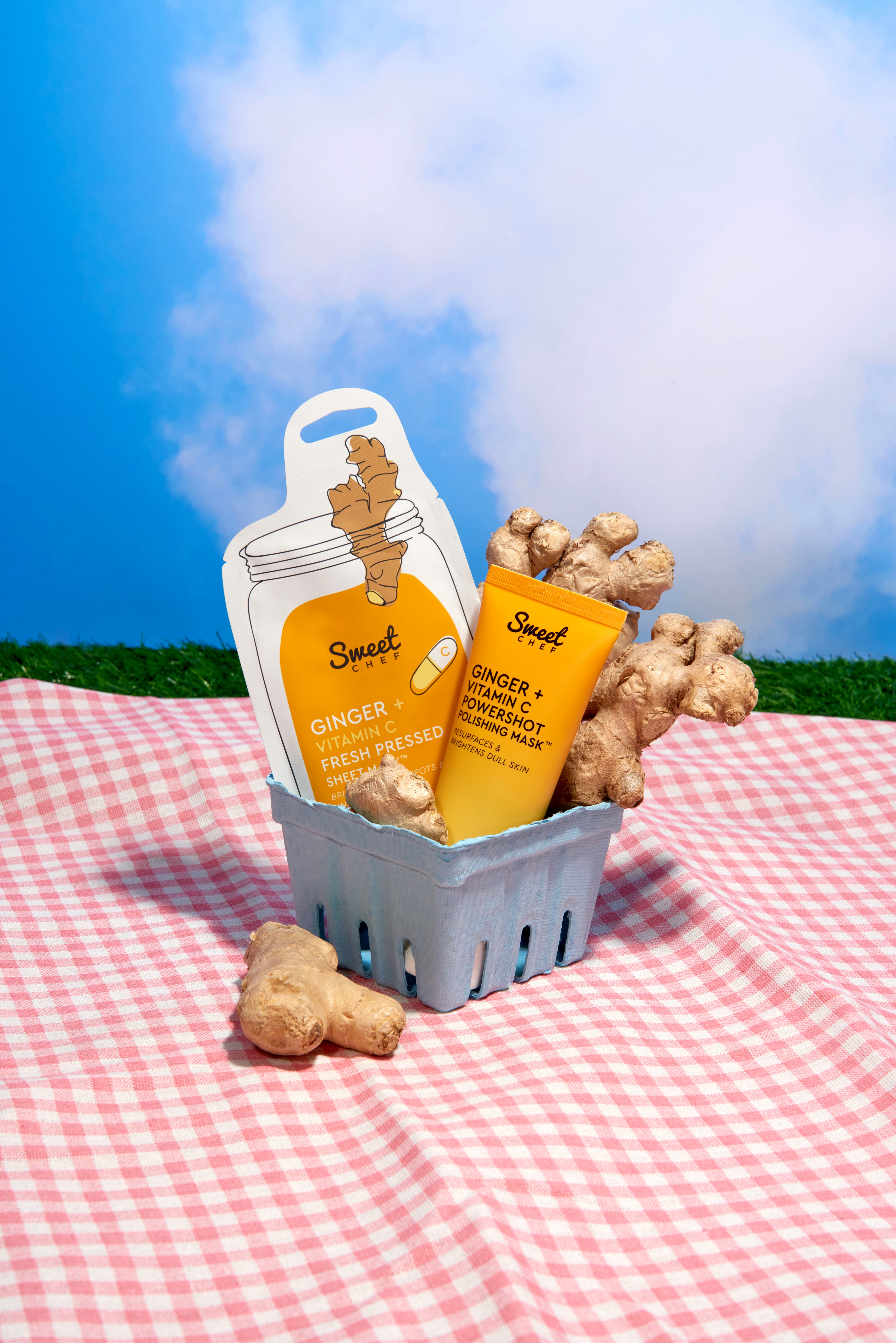 White branded cap with turquoise logo placed on fresh lemons in a red bowl