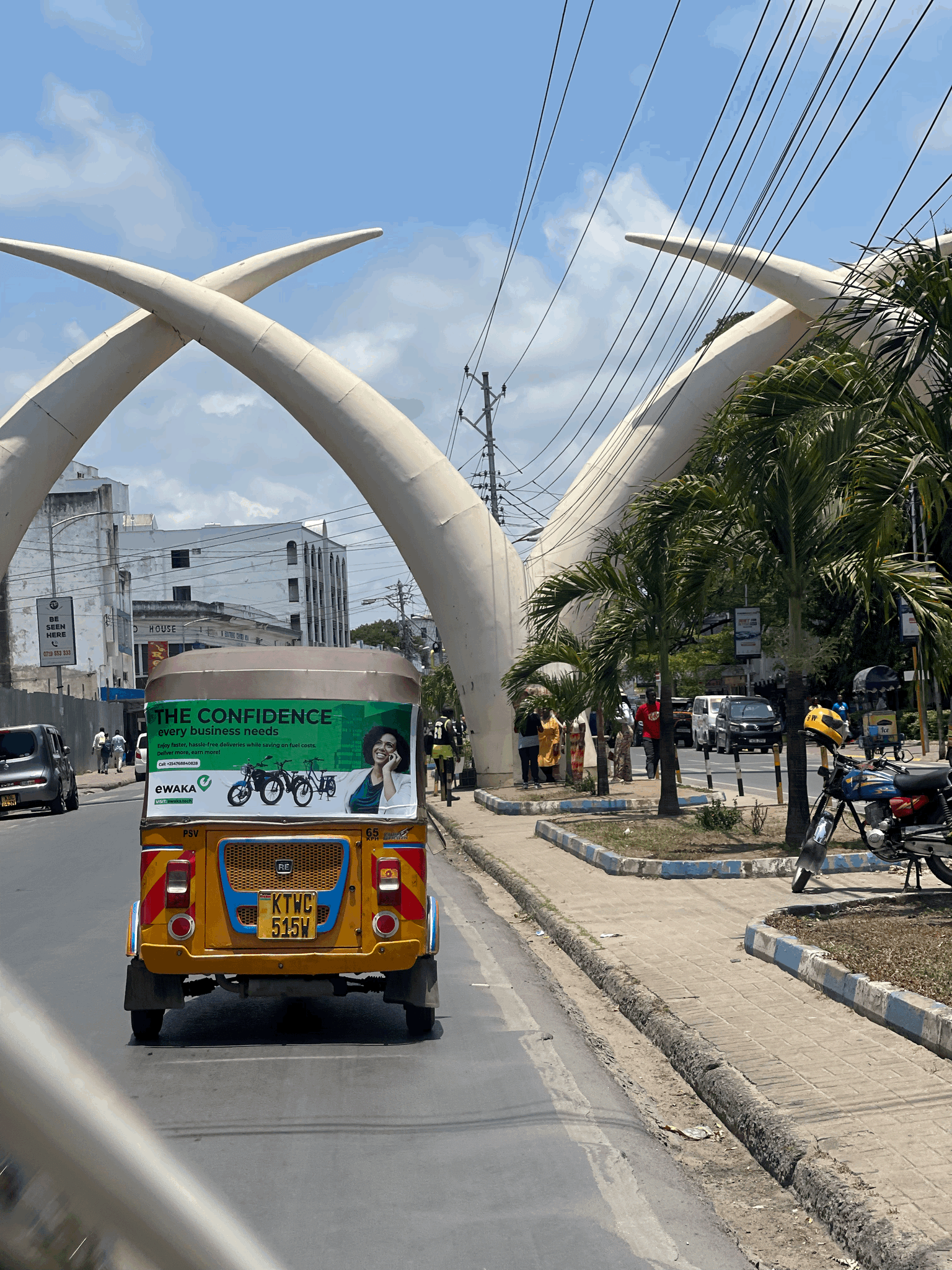 A silhouette stands before glowing numbers in a dark