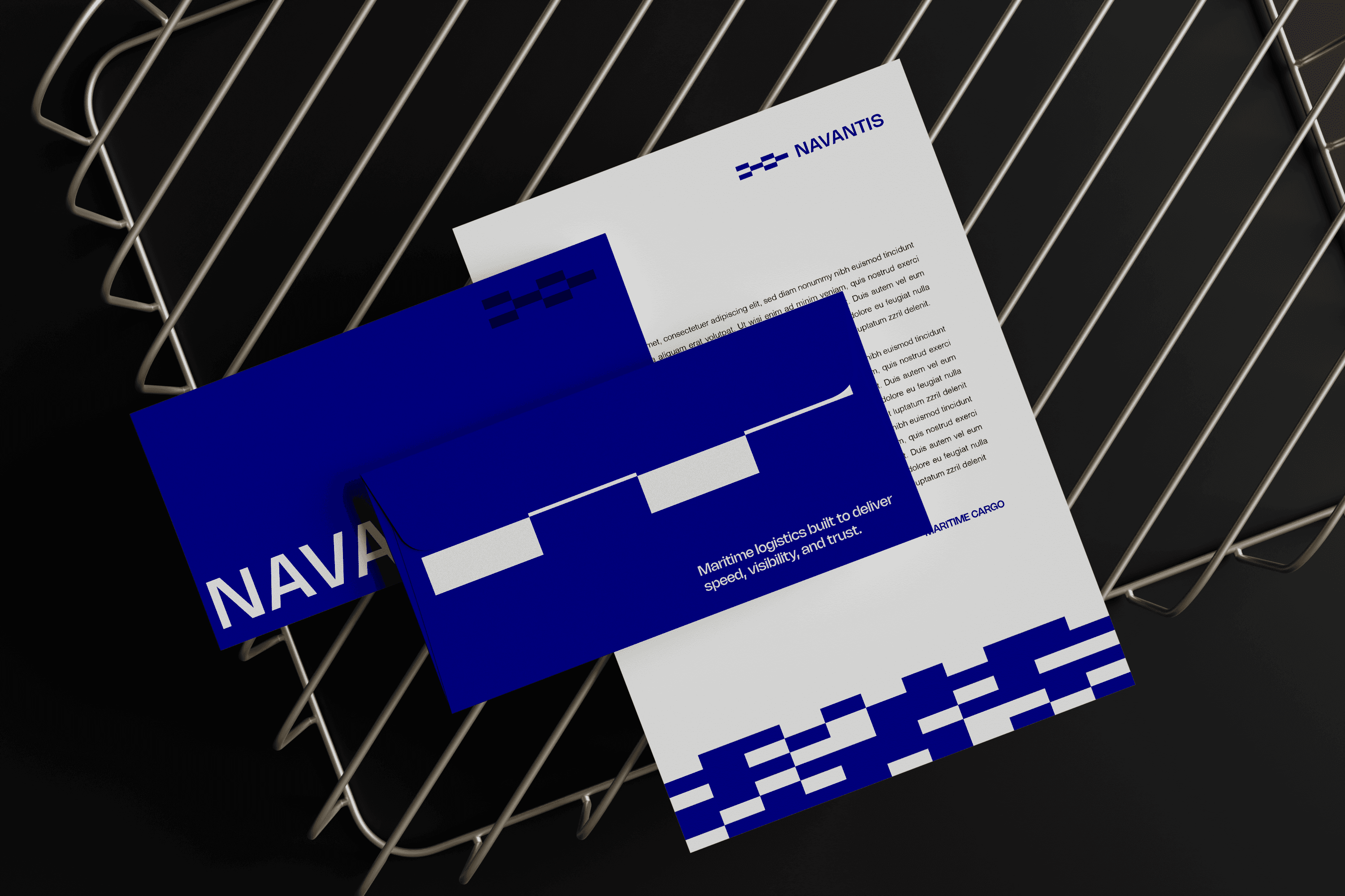 Navantis branding print mockup with blue stationery layered on a wire tray.