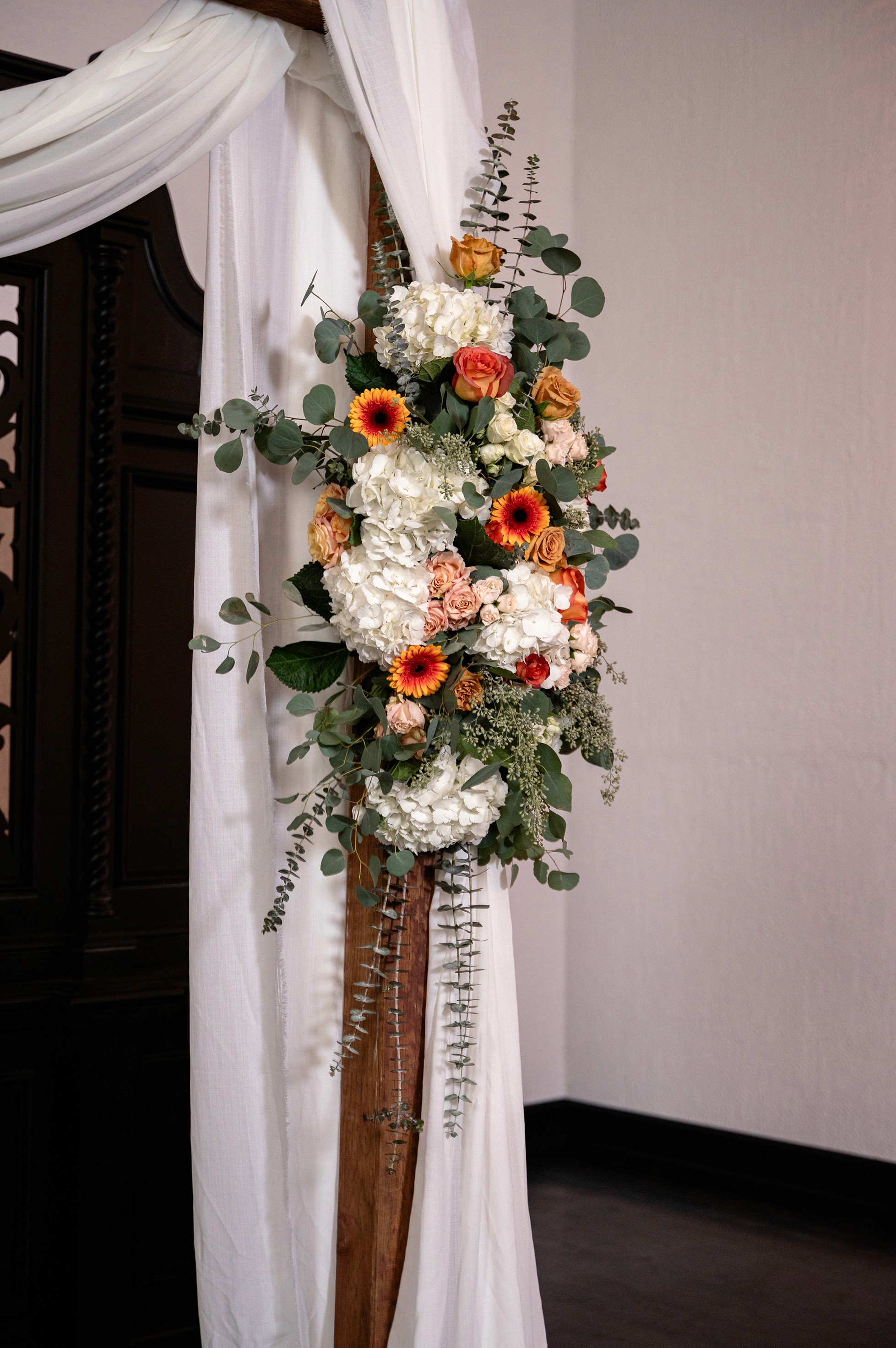 Flat lay wedding details with bouquet, rings, and sparkling bridal heels