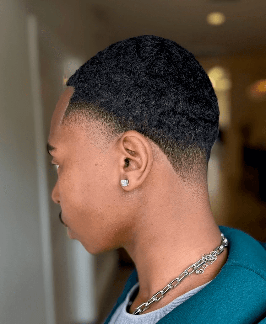 High Taper Fade.  Wavy hair.  Black male.  Barber. Beverly Hills. Bomane Salon. Courtney Palmore. Luxury Barber. Hairstylist. Sharp Line Up