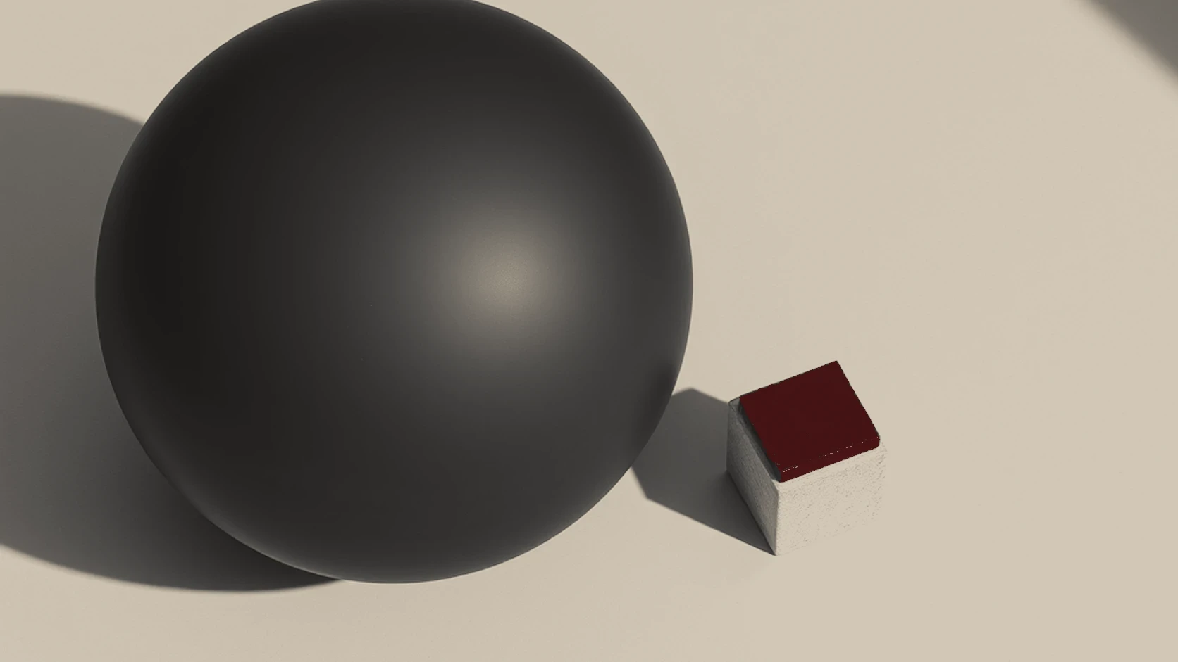 A conceptual still life featuring a black sphere and a red block, symbolising how a brand's presence provides the context needed for consumer recognition.