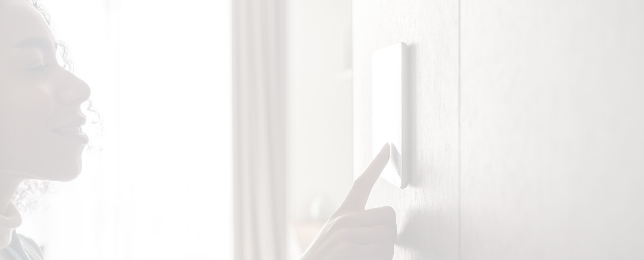 Woman entering personal pin information into smart security system.