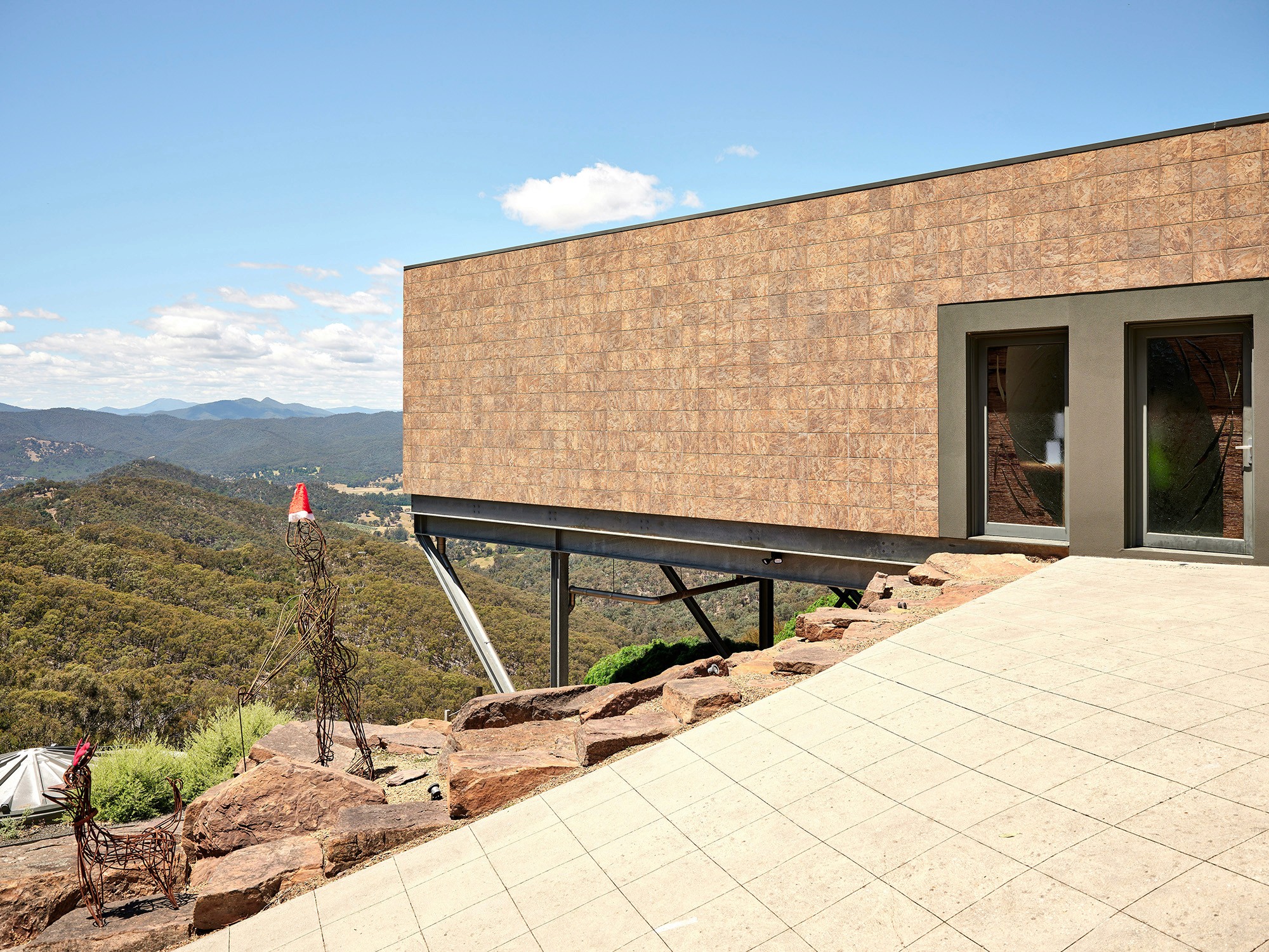 Modern building with tile facade on a hillside
