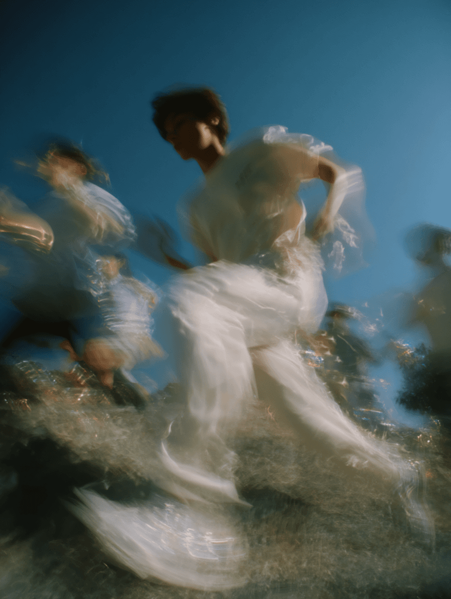 Two performers moving in open air during PRVSM London takeover announcement.