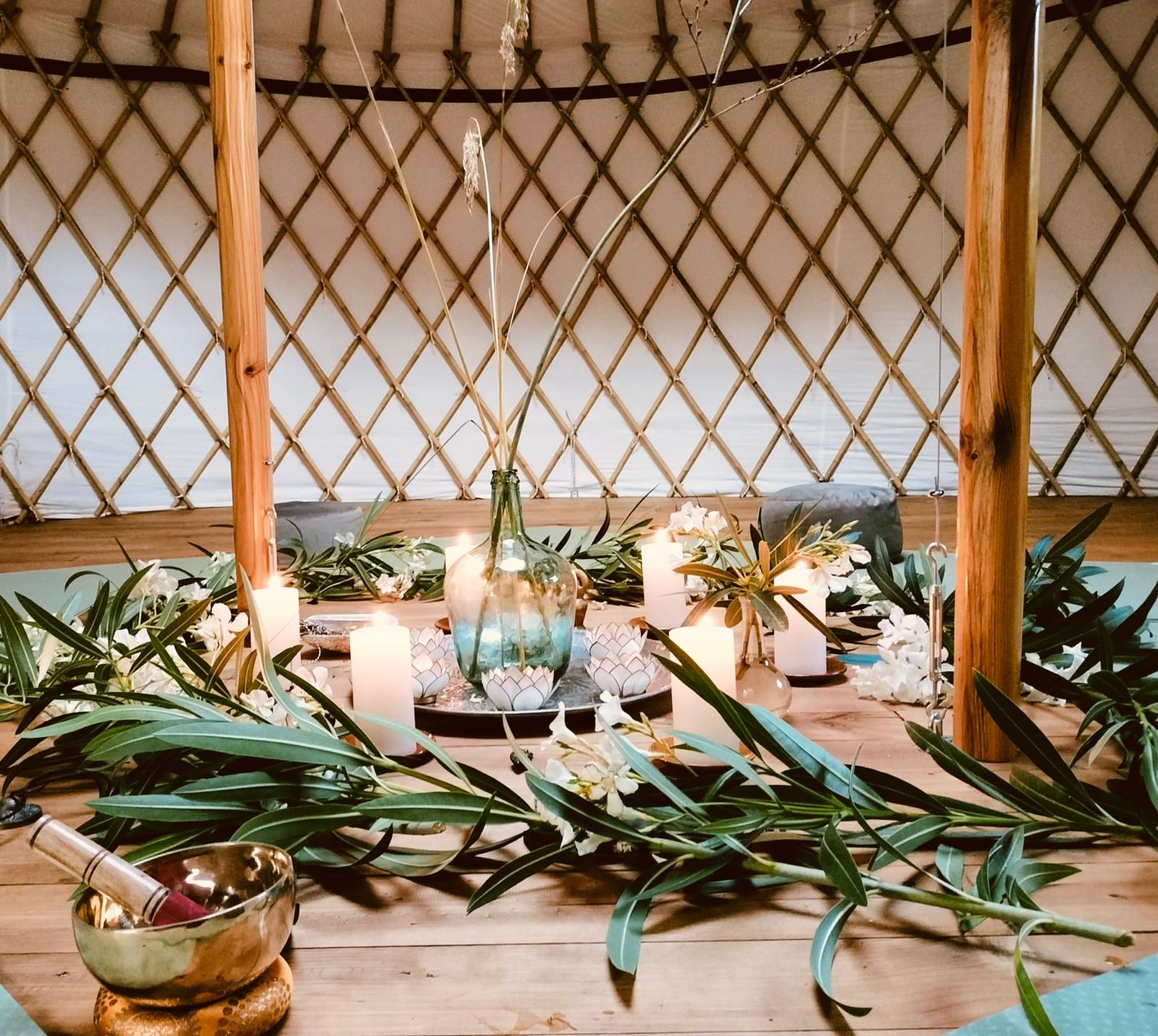 orange throw pillow on gray couch