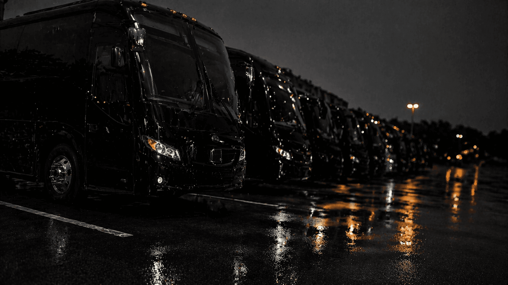 Two individuals are working out in a gym, focusing on dumbbells and strength training equipment.