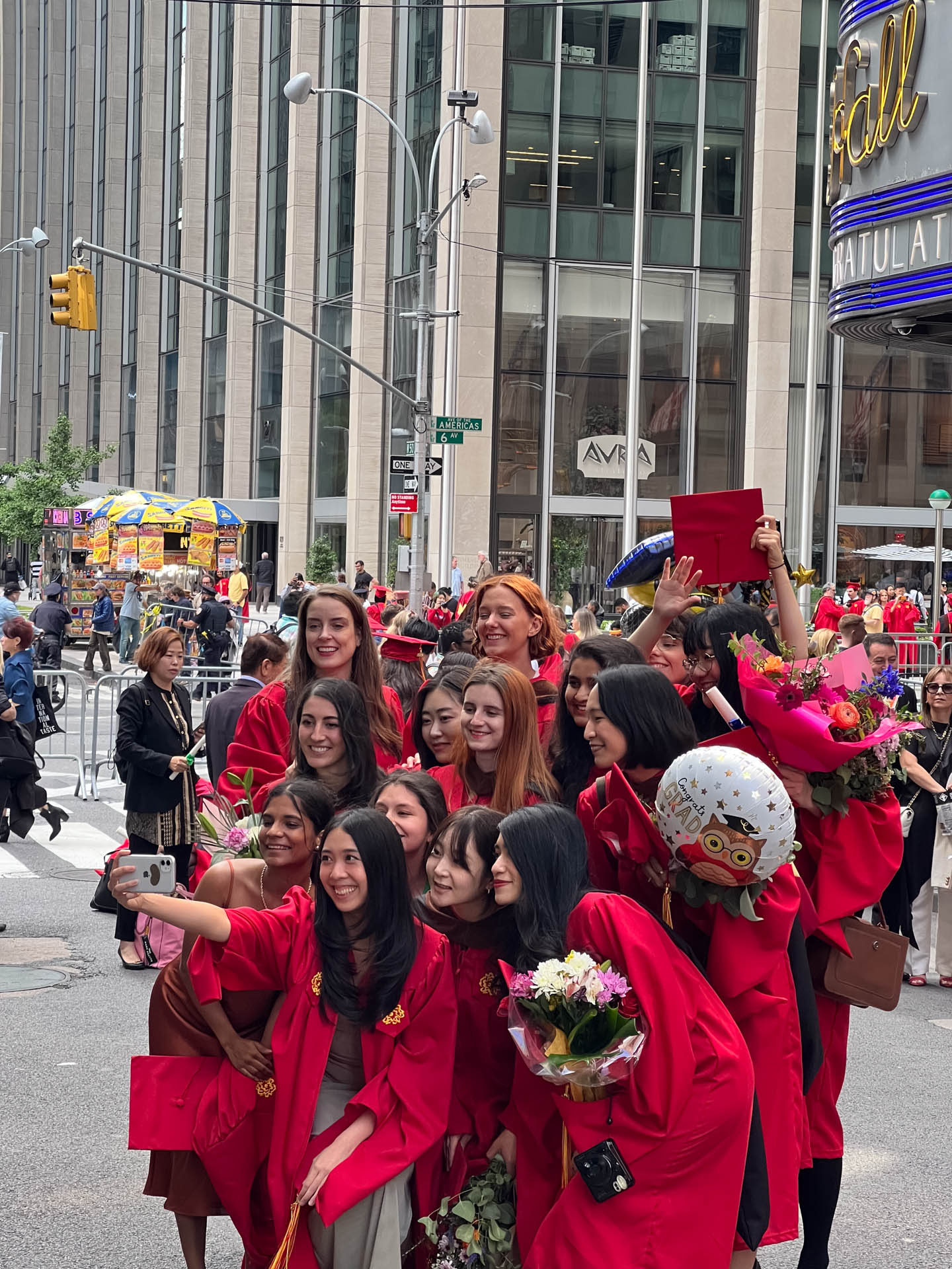 students taking selfies outside of Radio City Music hall