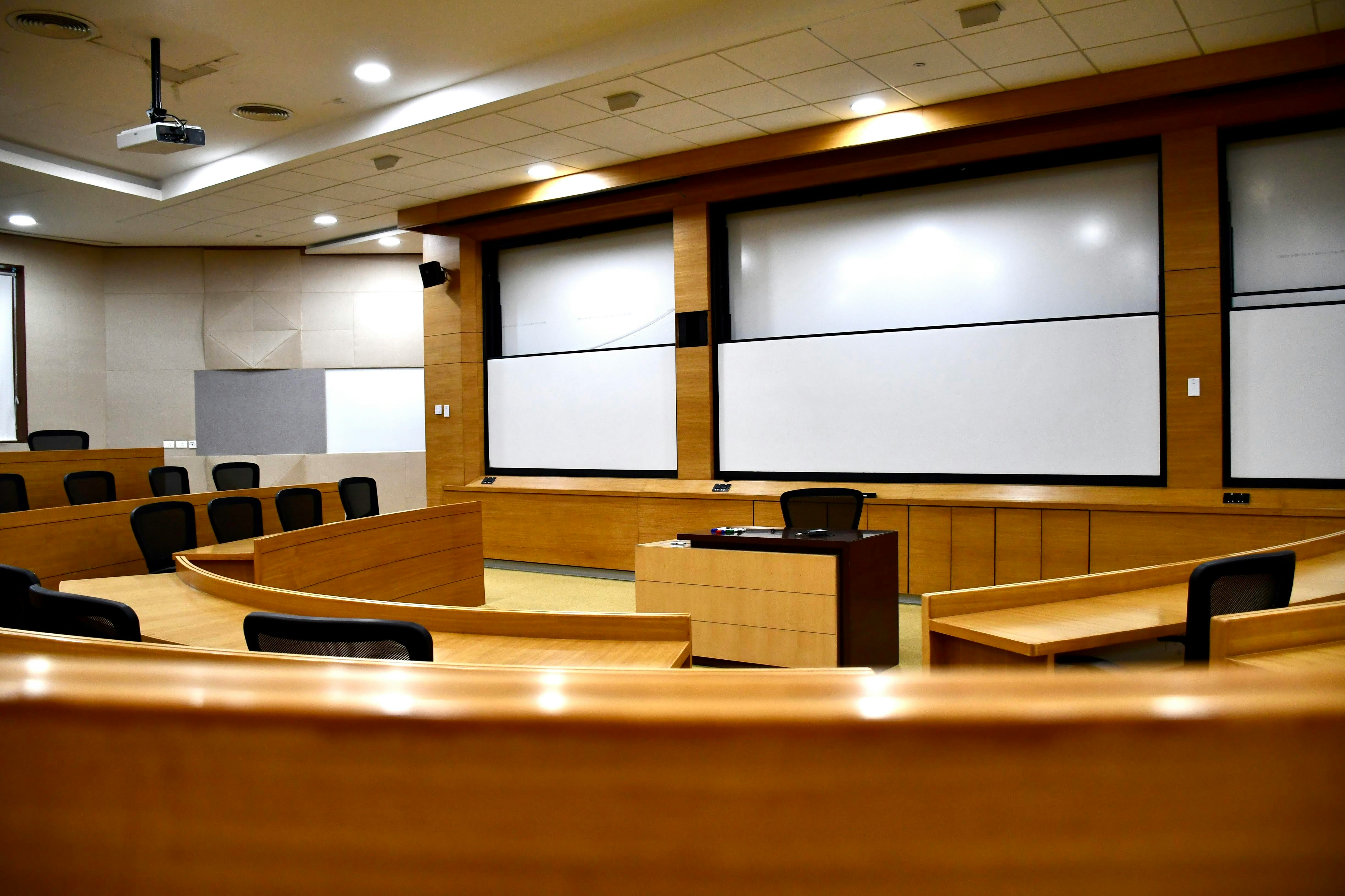 An empty conference room with a projector screen